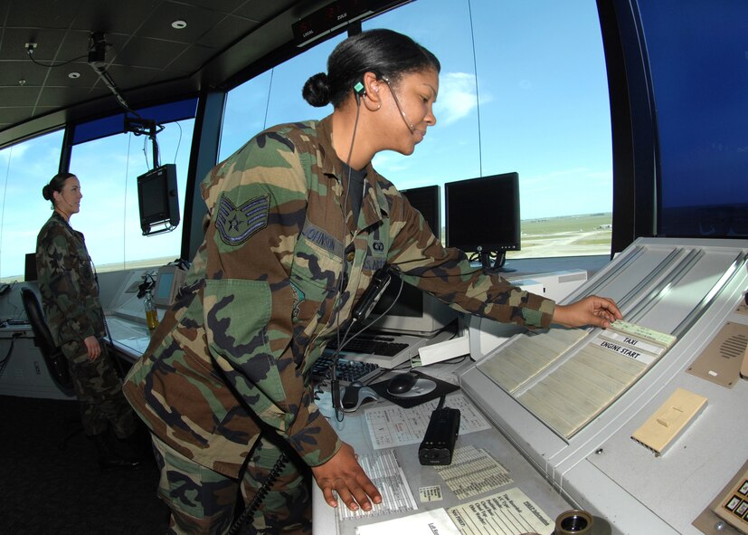 From the Travis Air Force Base Tower, Staff Sergeant Natalie Johnson a member of the 60th Operations Support Squadron updates a flight progress strip for an aircraft approaching the Travis Flightline.  The Travis Tower controllers handle 37,000 flights annually.  USAF photo by Civ/Nan Wylie 