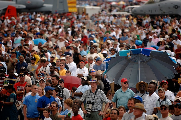 Visitors enjoy the aerial demonstrations along with ground displays during the 2008 "Wings Over Charleston" Air Expo at Charleston AFB April 26. More than 136,000 people visited the base during the one-day expo highlighting the Airmen and aircraft of the world's most dominant air, space and cyberspace Air Force. (U.S. Air Fore photo/Senior Airman Nicholas Pilch)