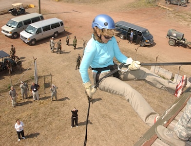 Lucia Dougherty, a Joint Civilian Orientation Conference participant, rappels off the tower at Soto Cano Air Base, Honduras. JCOC visited Soto Cano Air Base Apr. 24 as part of a tour of locations throughout the U.S. Southern Command area of responsibility. (Photo by Martin Chahin)                               