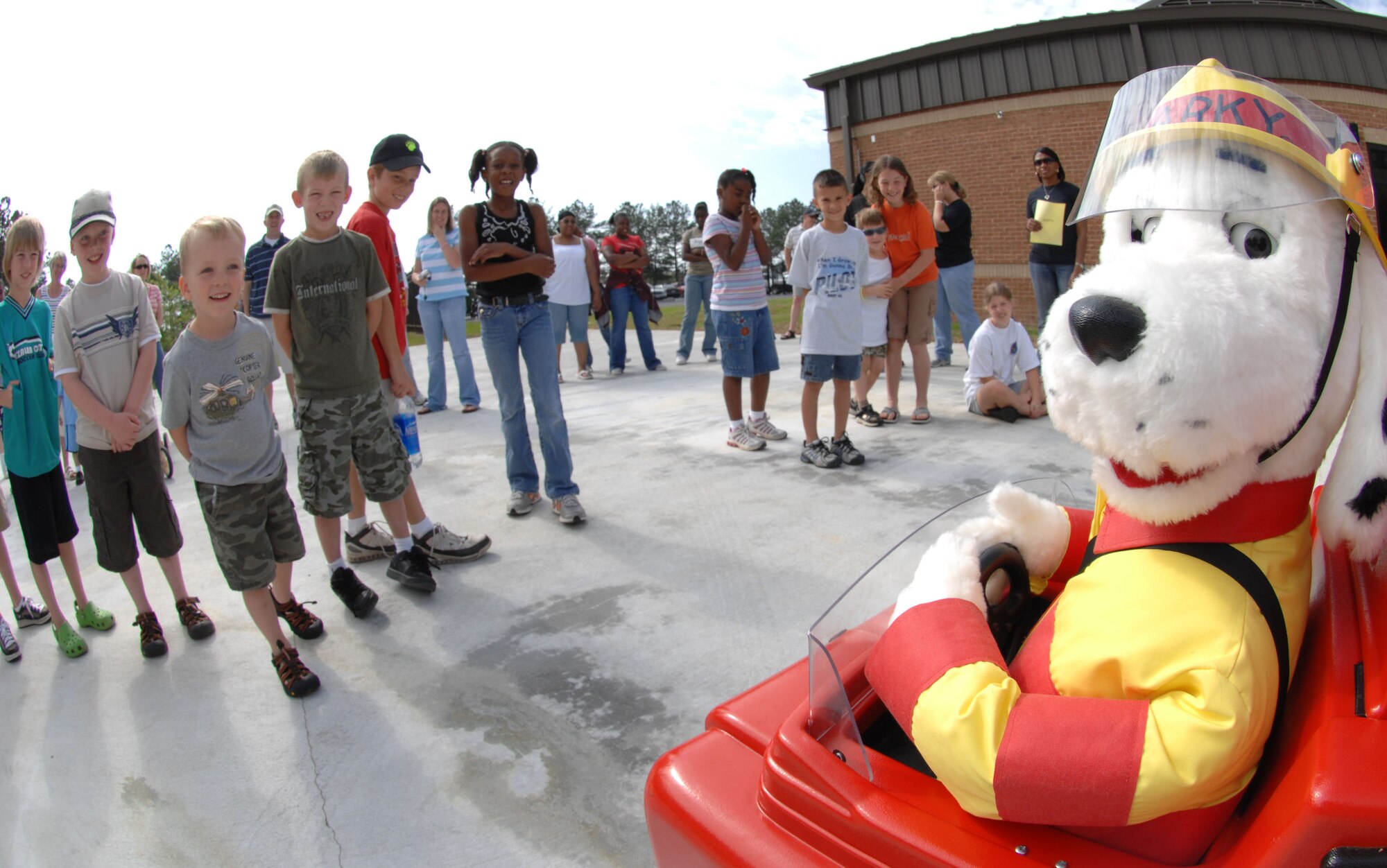 MOODY AIR FORCE BASE, Ga. – Sparky, 23rd Civil Engineer Squadron fire fighters mascot, entertains children before they participate in a kid’s deployment line here April 26.  The kid’s deployment line gave children the oppurtunity to see how their parents prepare for deployment. (U.S. Air Force photo by Senior Airman Angelita Lawrence)