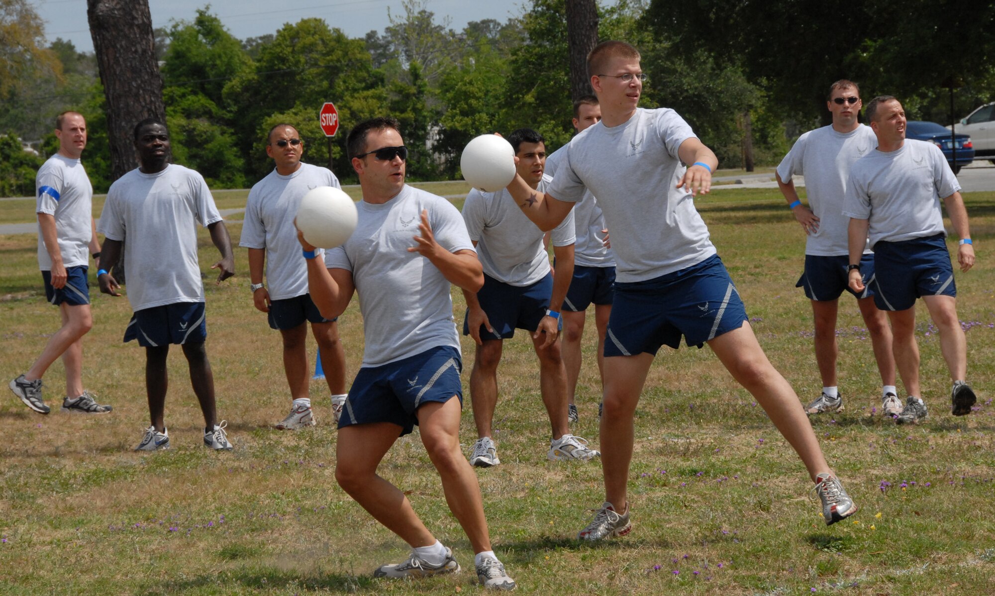 Staff Sgt. James Morris and Airman 1st Class Mathew Turcotte, 68th Electronic Warfare Squadron, take aim at the 16th Electronic Warfare Squadron players during a three-way dodge-ball match during the 53d EWG’s Sports Day April 25 at Eglin Air Force Base, Fla.  Photo by Staff Sgt. Samuel King Jr.