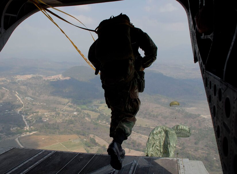 SOTO CANO AIR BASE, Honduras-- A paratrooper leaps from the back of a Joint Task Force-Bravo CH-47 Chinook helicopter over the Tamara Drop Zone, the site of this year's Iguana Voladora 2008. The airborne exercise is Joint Task Force-Bravo's largest joint and combined training event developed to strengthen regional cooperation and security between countries of the Americas. (U.S. Air Force photo by Tech. Sgt. William Farrow)