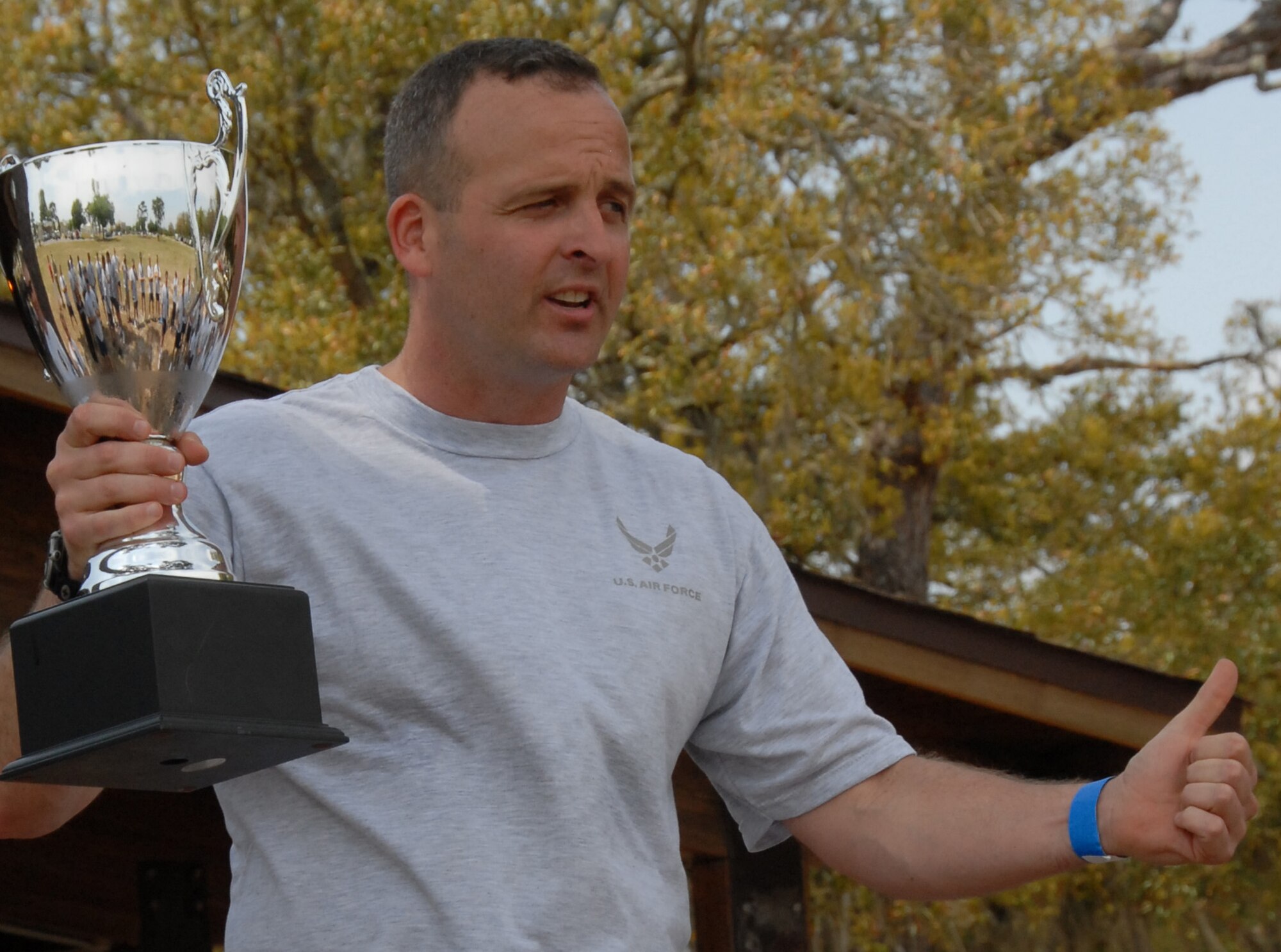 Lt. Col. Robert Kraus, 68the Electronic Warfare Squadron commander, congratulates his squadron on winning the 53d Electronic Warfare Group Sports Day cup April 25 at Eglin Air Force Base, Fla.  The 68th EWS narrowly beat out the 16th Electronic Warfare Squadron to win the trophy.  Photo by Staff Sgt. Samuel King Jr.