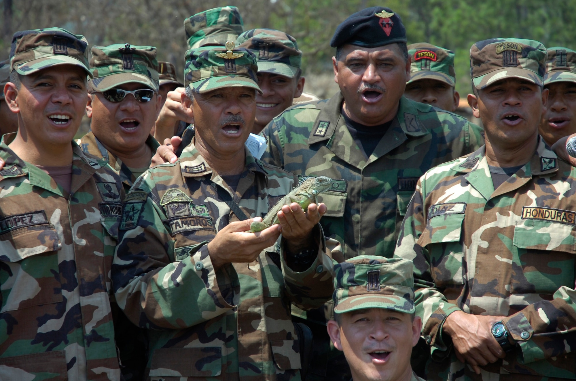 SOTO CANO AIR BASE, Honduras--Honduran Special Forces soldiers render a battle cry while posing with an iguana during Iguana Voldara 2008, a combined airborne operation in which jumpers represented 16 north, central and south American countries near Tegucigalpa, Honduras, April 23. (U.S. Army photo)