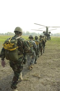 SOTO CANO AIR BASE, Honduras--Paratroopers load onto a CH-47 Chinook during Iguana Voldara 2008, a combined airborne operation in which jumpers represented 16 north, central  and south American countries near Tegucigalpa, Honduras, April 23. (U.S. Army photo)