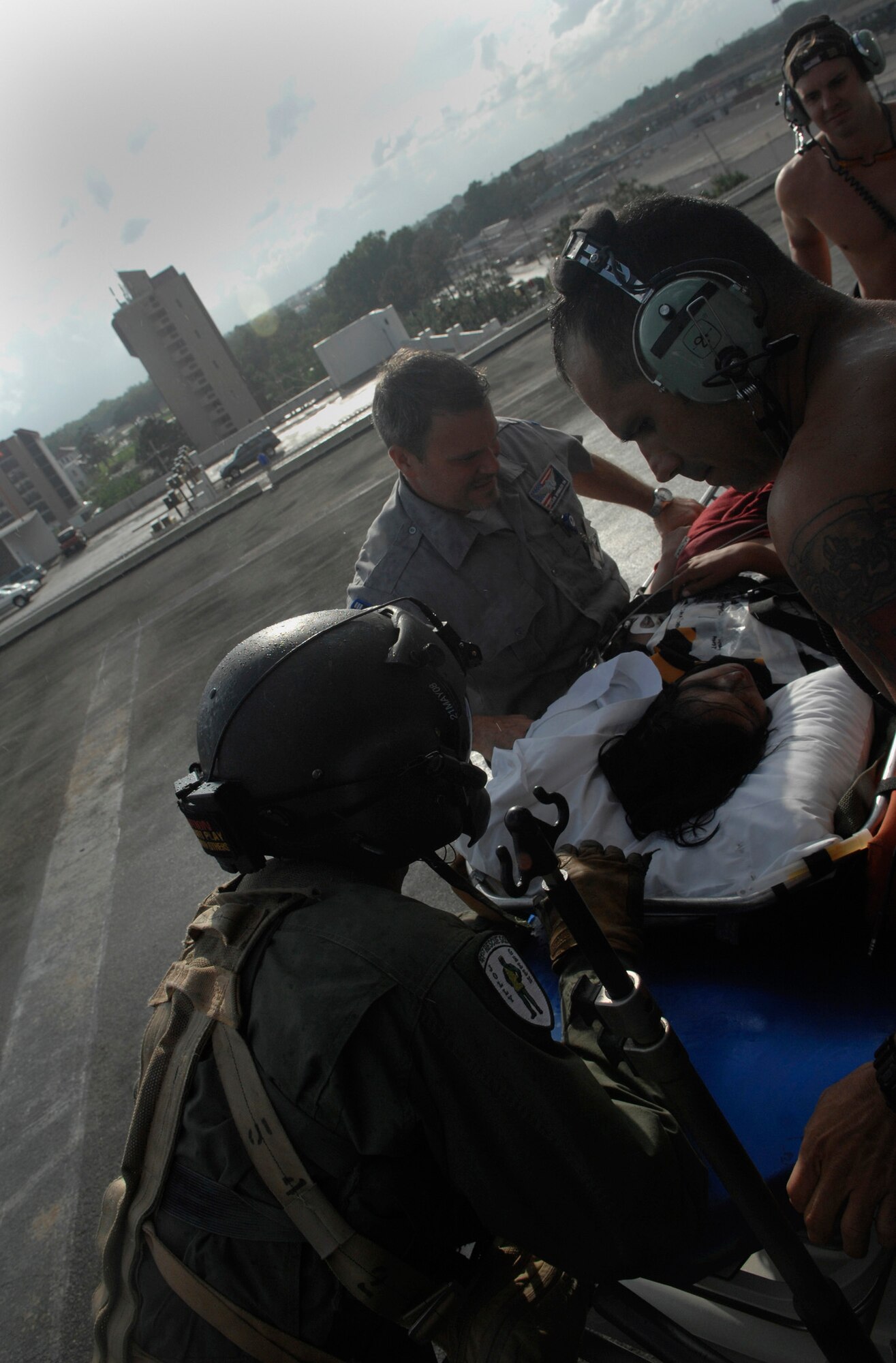 NEW ORLEANS, La. --  Pararescuemen from the 38th Rescue Squadron and HH-60G Pave Hawk aircrew with the 41st Rescue Squadron out of Moody Air Force Base, Ga., put a survivor on a stretcher at a medical facility in New Orleans, La., during a rescue mission April 25. (U.S. Air Force photo by Senior Airman Gina Chiaverotti) 