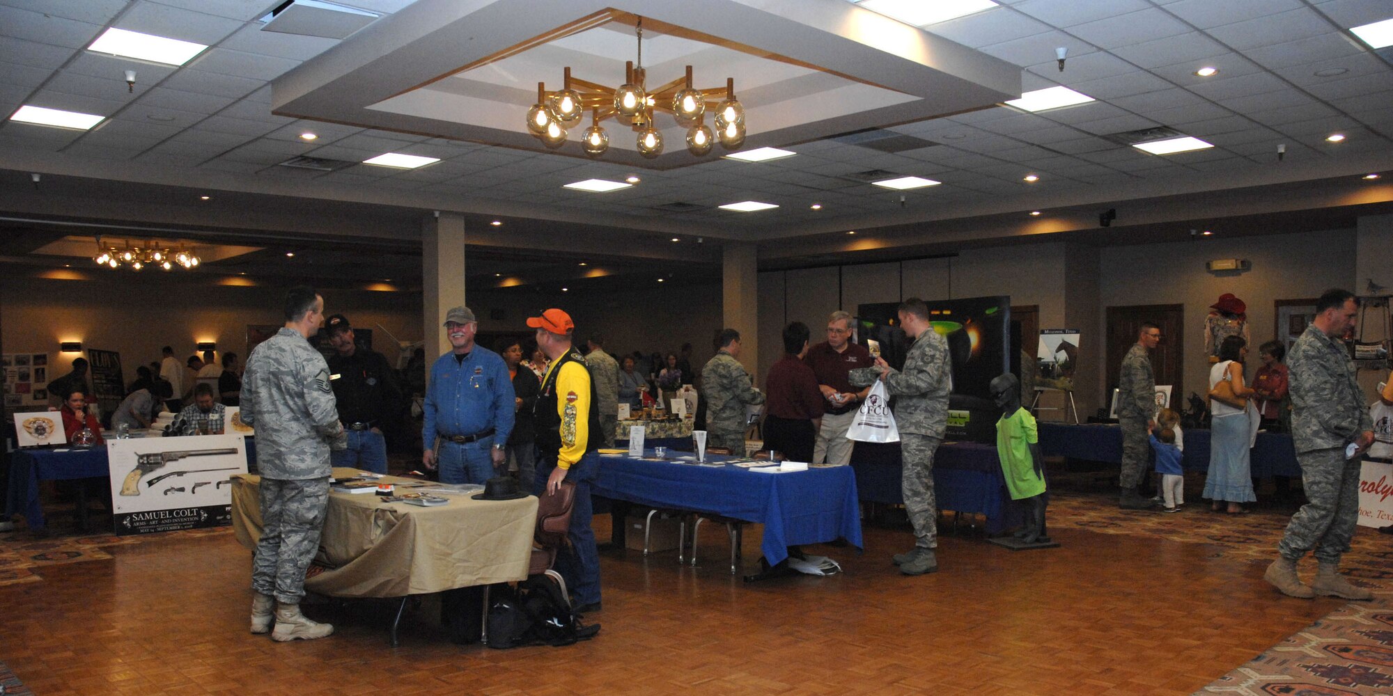 CANNON AIR FORCE BASE, N.M.-- Airmen from base visit different tables at the Landing during the Discover Home Fair April 25. The fair gives Cannon Airmen an opportunity to see what the state of New Mexico has to offer. (U.S. Air Force photo/Airman 1st Class Evelyn Chavez) 
