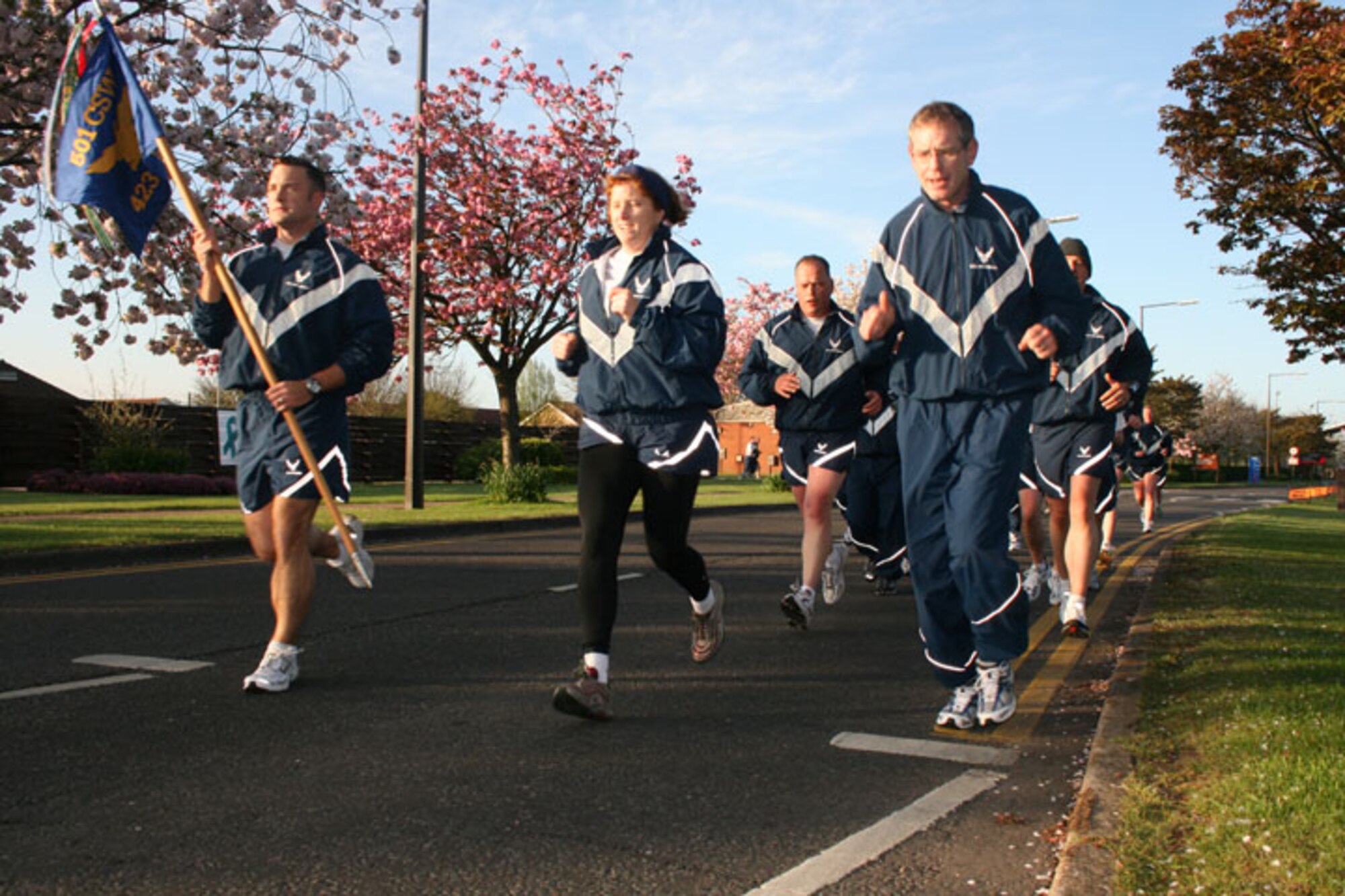 Col. Kimberly Toney and Col. John Jordan lead the pack during the Tri-Base Earth Day Warrior Run. Colonel Toney is the 501st Combat Support Wing commander and Colonel Jordan is the 423rd Air Base Group commander.