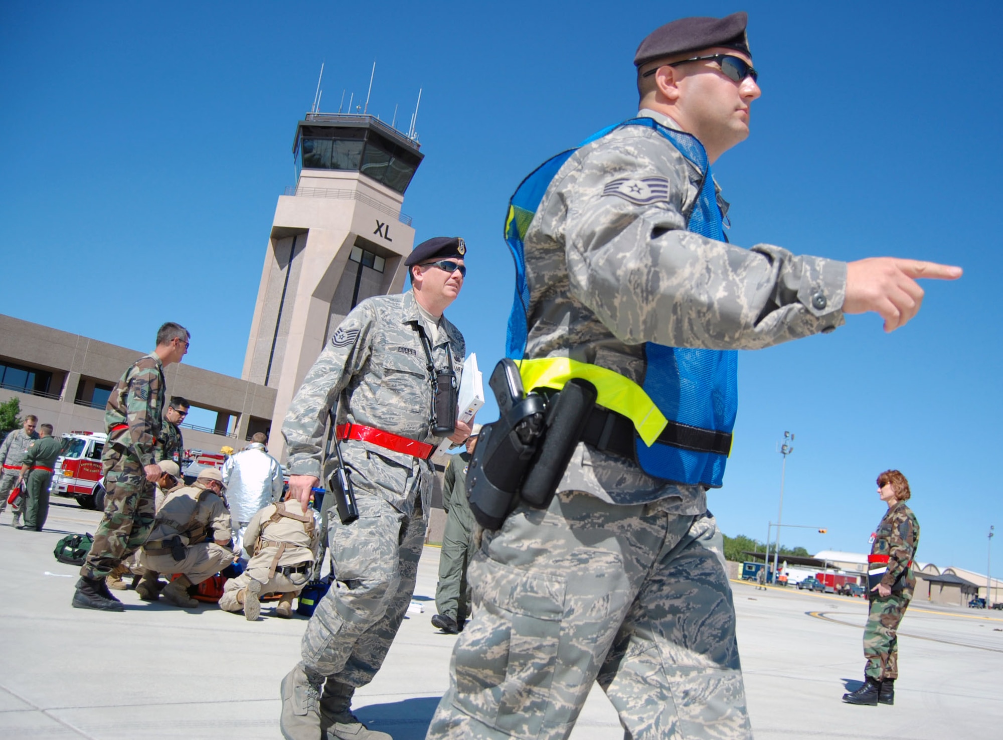 LAUGHLIN AIR FORCE BASE, Texas – Staff Sgt. Nicholas Ehlinger, 47th Security Forces Squadron and Tech Sgt. Thomas Cooper, 47th SFS, rush to the cordon area around the exercise area to assist teammates in helping the exercise on the flight line April 18. Laughlin conducted multiple exercises to prepare for upcoming air show May 10. (U.S. Air Force photo by Airman 1st Class Sara Csurilla)