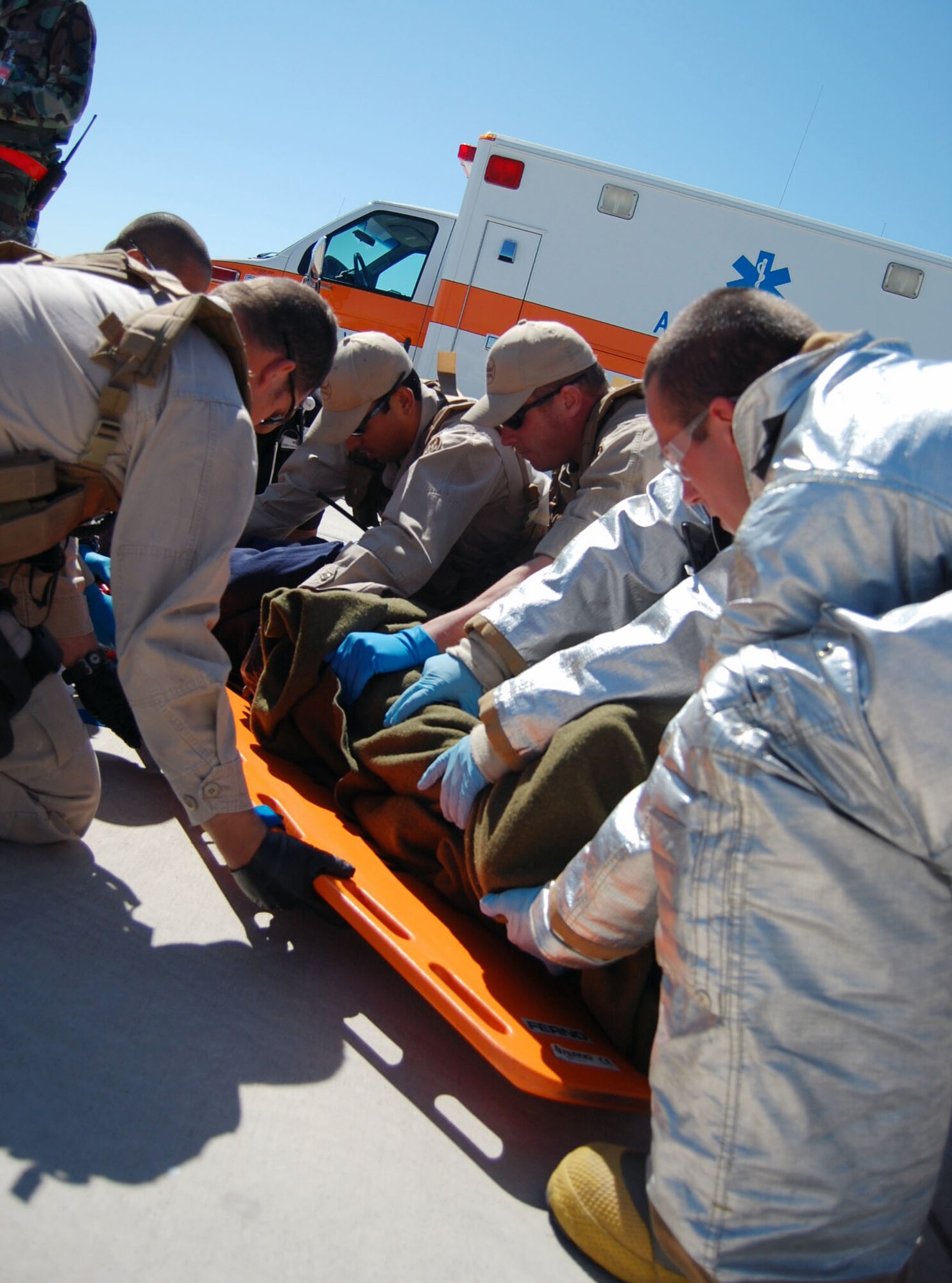 LAUGHLIN AIR FORCE BASE, Texas – Staff Sgt. Nicholas Ehlinger and Tech Sgt. Thomas Cooper, 47th Security Forces Squadron, rush to the cordoned area to assist their teammates during an exercise conducted here April 18. Laughlin conducted multiple exercises to prepare for the upcoming air show May 10. (U.S. Air Force photo by Airman 1st Class Sara Csurilla)