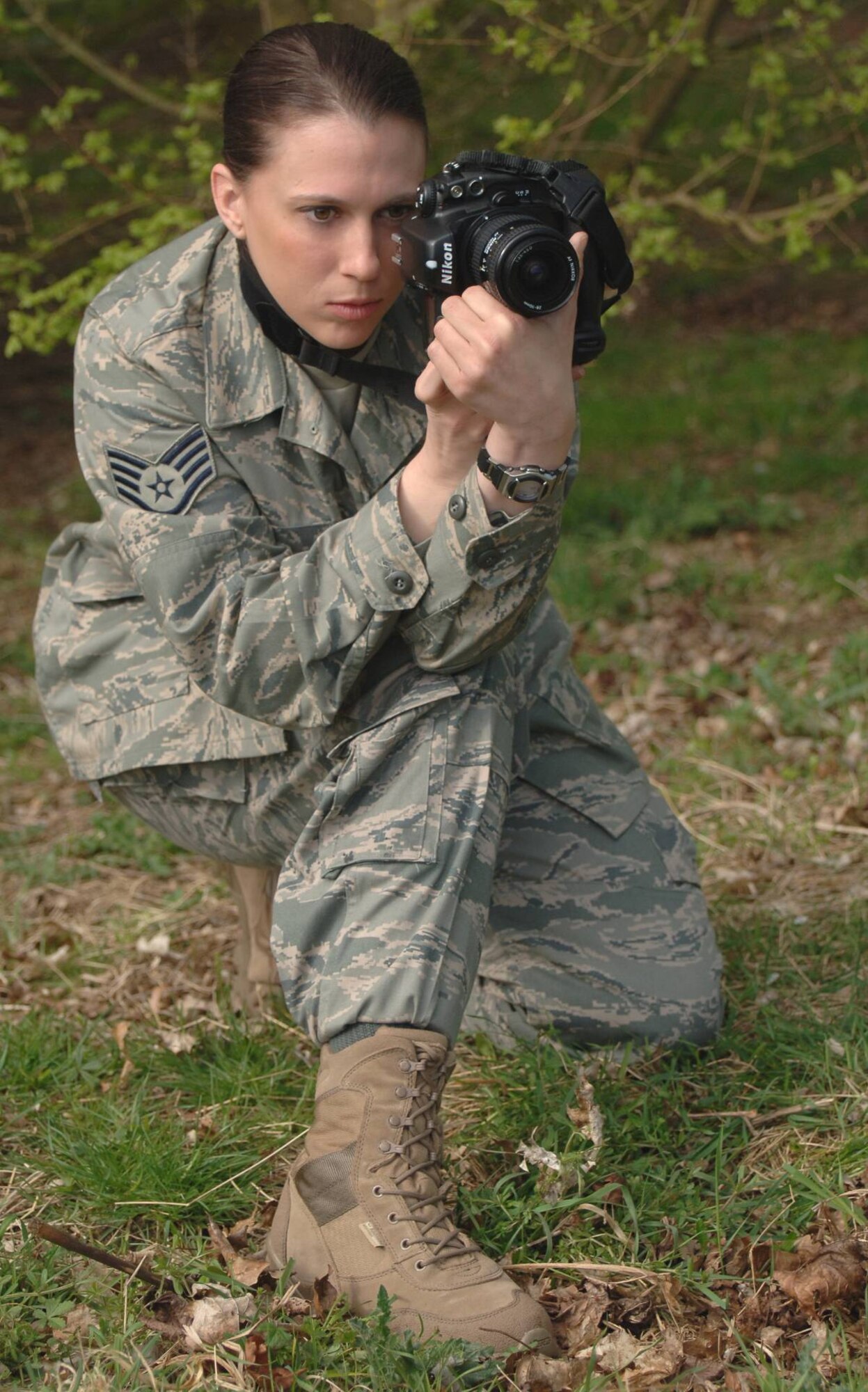Military Photographer Staff Sgt. Jocelyn L. Rich, USAF sets up a shot on a photo shoot for the JIOCEUR Analytic Center. Staff Sgt. Rich has been selected for the prestigious Newhouse Photojournalism Program at Syracuse University. The program lasts an academic year beginning in August. (USAF Photo by Staff Sgt. Chad E. Chisholm, USAF) 
