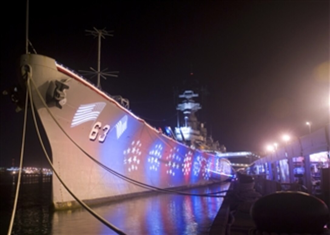 The battleship USS Missouri Memorial is illuminated in red, white and blue for the 23rd annual Hawaii Military Appreciation Month opening ceremony, April 24, 2008. The ceremony kicked off a month-long celebration to express appreciation and "mahalo" to Hawaii's servicemembers for their everyday sacrifices here and abroad. 