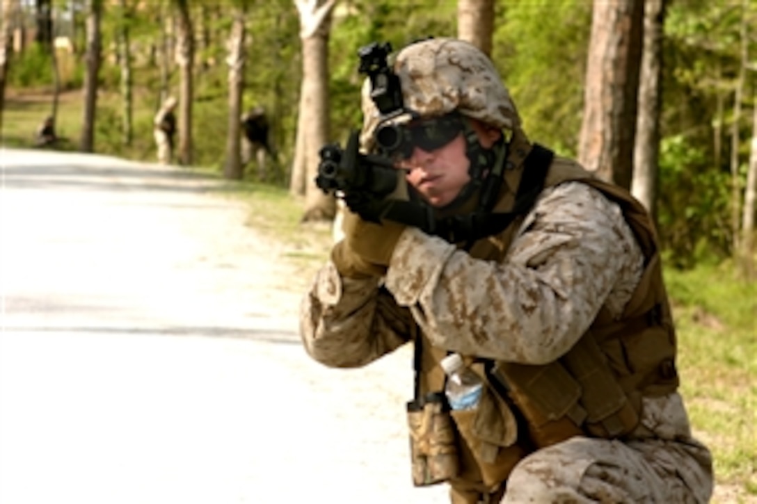 U.S. Marine Sgt. Damien Senerchia assesses a potential threat while leading his squad through the Combat Hunter course on Camp Pendleton, Calif., April 25, 2008. Senerchia is assigned to Combat Logistics Battalion-26, 2nd Marine Logistics Group. The course trains Marines to fight better in small units.  