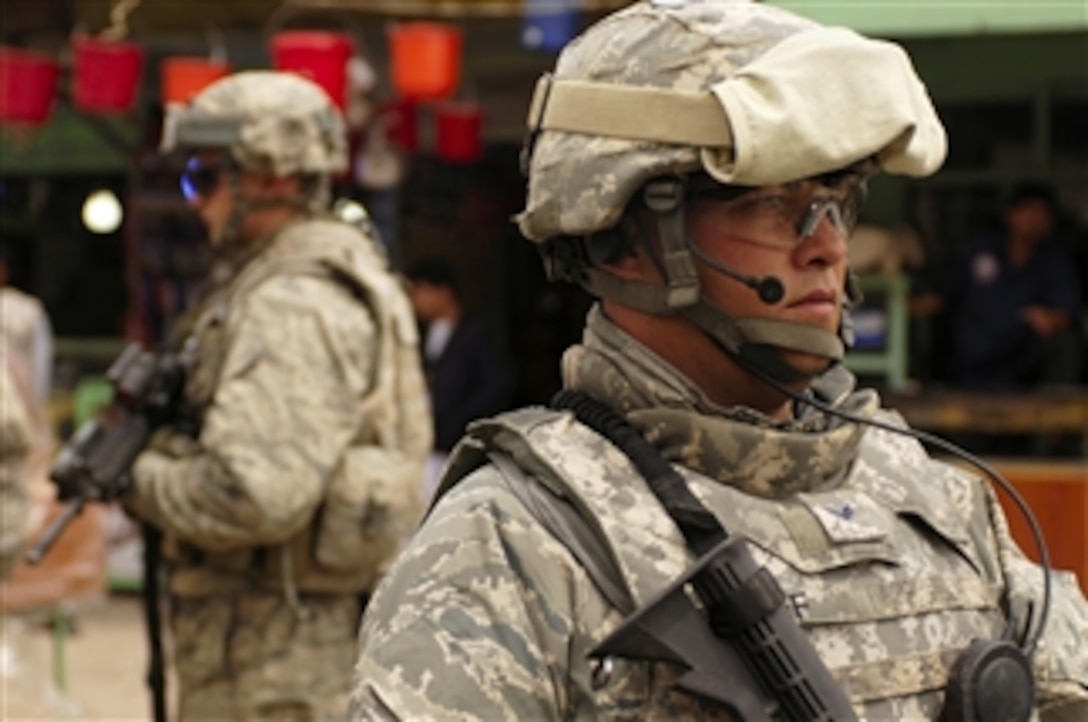 U.S. Air Force Senior Airmen Mark Ostrander and Andrew Kief conduct a foot patrol in Charikar, Afghanistan, April 22, 2008. Both airmen are assigned to the police advisory team of the Charikar Provincial Reconstruction Team. 