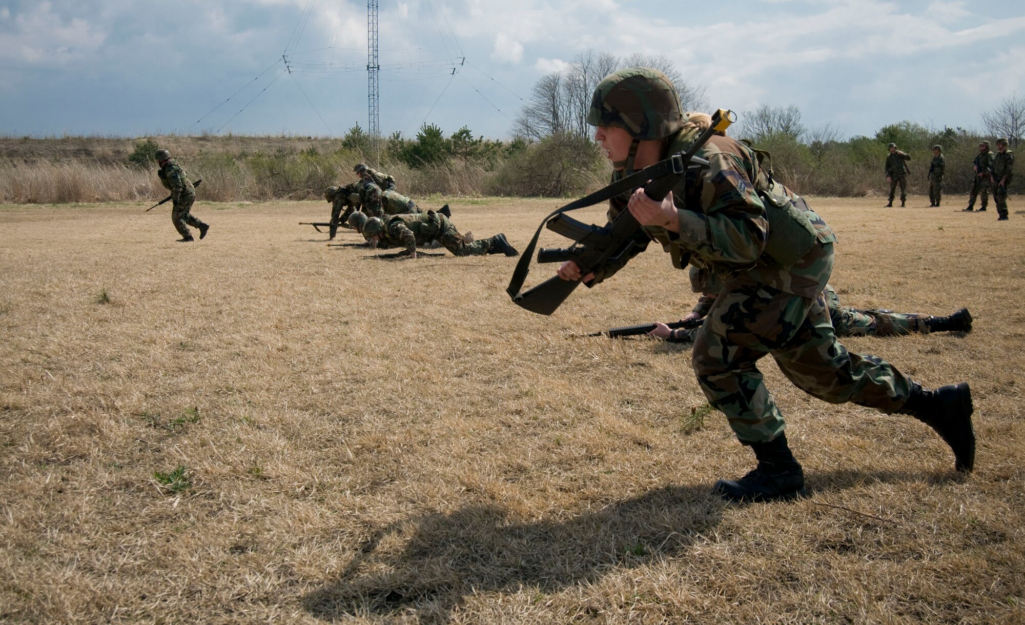 MISAWA AIR BASE, Japan -- Airman 1st Class Samantha Lawrence, Misawa Security Operations Center, begins a three to five second rush at Camp Defender on April 25, 2008. The "rush" is one of the three individual movement techniques Airman Lawrence learned during the three-day Expeditionary Combat Skills Training at Misawa Air Base. (U.S. Air Force photo by Senior Airman Samuel Morse)