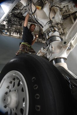 ANDERSEN AIR FORCE BASE, Guam -- Staff Sergeant Cory Cahill inspects a wheel well as part of routine pre-flight maintenance on a B-2 Spirit stealth bomber. Sergeant Cahill is part of a maintenance team supporting the remaining B-2 Spirits at Andersen AFB. Keeping the B-2 Spirit bomber at a mission-ready status requires lots of hard work and a huge team effort by all maintainers working on the multi-role stealth bomber. The B-2s here have remained suspended pending the results from a safety investigation board following the first-ever crash of a stealth bomber Feb. 23 here, at Andersen AFB. The continuous bomber presence demonstrates U.S. commitment to promote security and stability in the Pacific region. Sergeant Cahill is with the 36th Expeditionary Aircraft Maintenance Squadron and is deployed from the 509th Bomb Wing, Whiteman, AFB, Mo. (U.S. Air Force photo by Staff Sgt. Vanessa Valentine)
