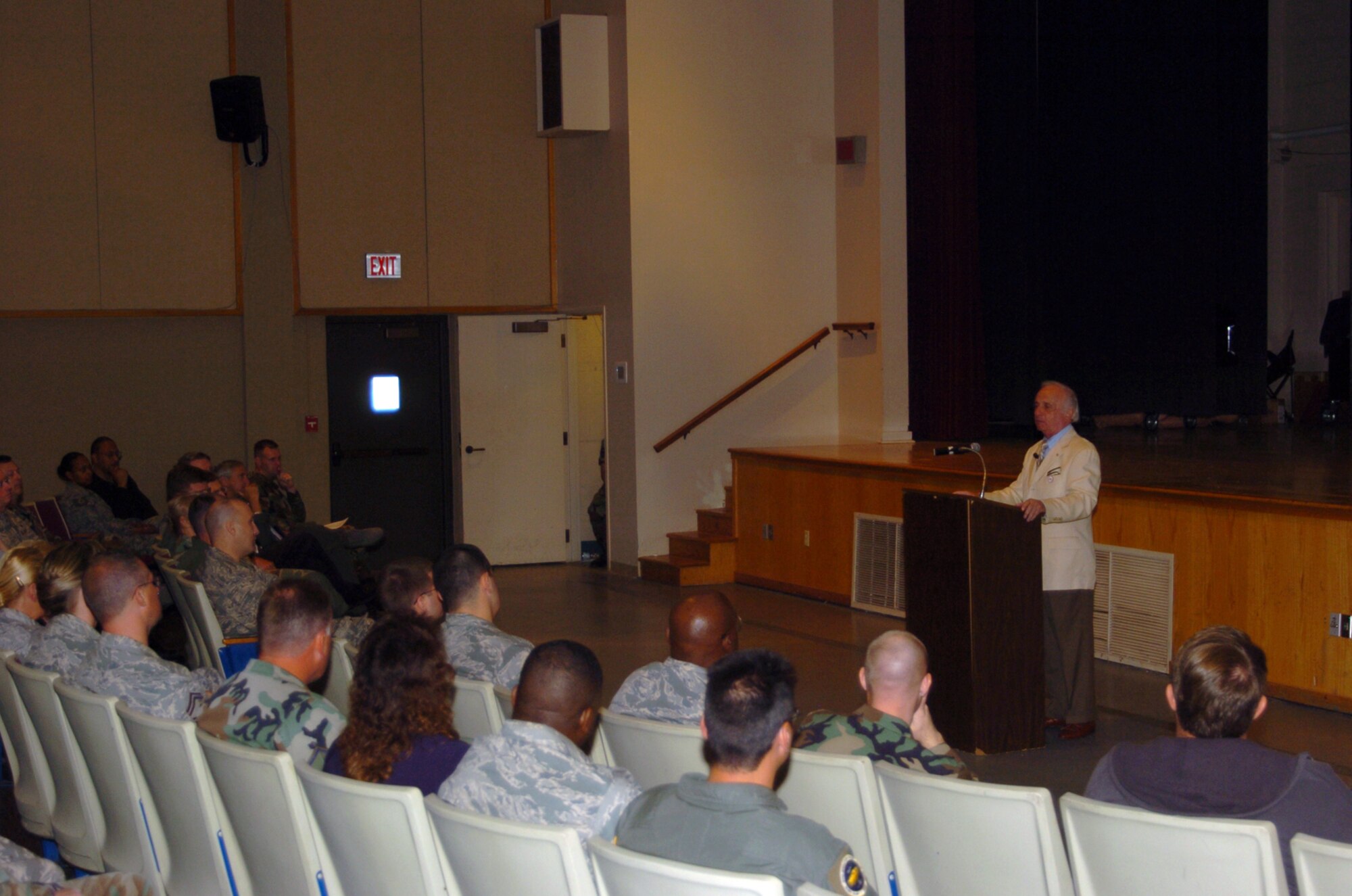 ALTUS AIR FORCE BASE, Okla. -- Jack Adler (right), a Holocaust survivor, tell Altus AFB personnel his story of captivity at the Auschwitz Concentration Camp, the largest concentration camp during World War II, at the Base Theater April 29. Mr. Adler spook against the destructive force of hatred, and reminded everyone of the Golden Rule, "Do unto other as you would have them do unto you." Mr. Adler came to speak on behalf of the Remembrance observation for the month of April. (U.S. Air Force photo/Senior Airman Clinton)