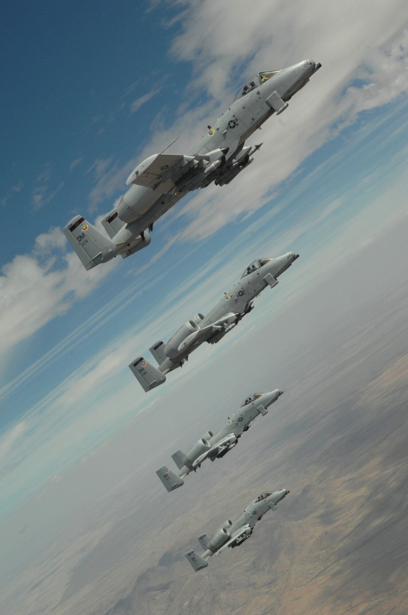 Four A-10s from Davis-Monthan fly in formation over Arizona April 29. The A-10s received in-flight refueling from a KC-135 from an Arizona Air National Guard unit based out Phoenix. The KC-135 was transporting Tucson community leaders to Nellis Air Force Base, Nev., for a Civic Leader Tour. (U.S. Air Force photo by Senior Airman Alesia Goosic)