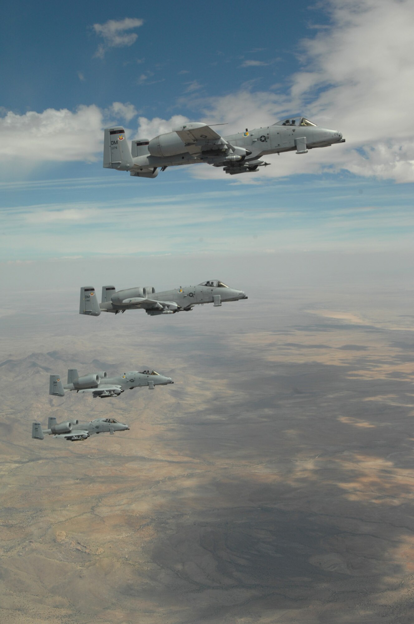 Four A-10s from Davis-Monthan fly in formation over Arizona April 29. The A-10s received in-flight refueling from a KC-135 from an Arizona Air National Guard unit based out Phoenix. The KC-135 was transporting Tucson community leaders to Nellis Air Force Base, Nev., for a Civic Leader Tour. (U.S. Air Force photo by Senior Airman Alesia Goosic)