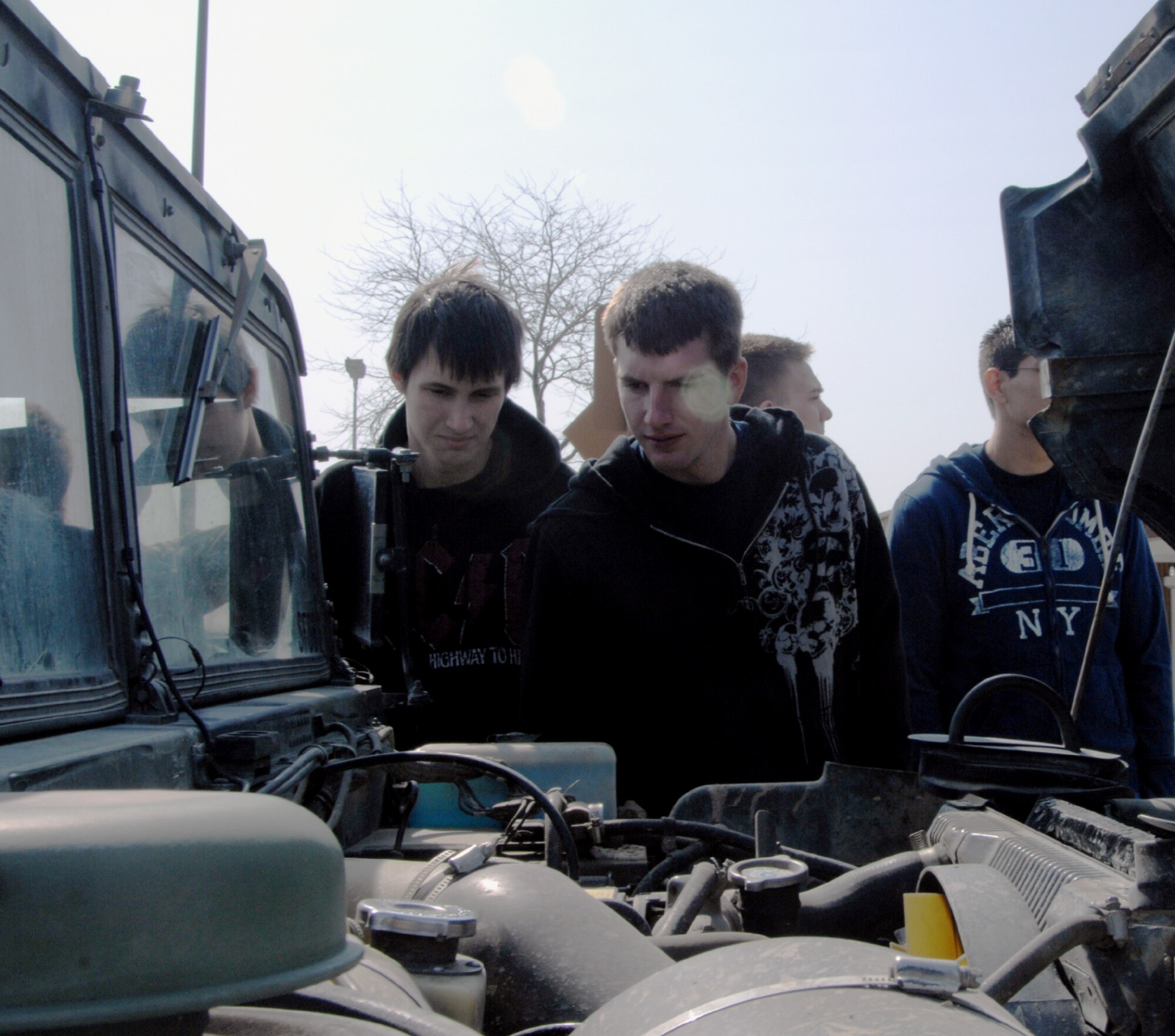 MOUNTAIN HOME AIR FORCE BASE, Idaho -- Delayed Entry Program members look under the hood of a HUMVEE during the 366th Security Forces Squadron portion of their tour here, April 25. The DEP members toured the base for a first-hand look at what it means to be a Gunfighter at Mountain Home Air Force Base and an Airman in today’s Air Force. The group visited the 389th Aircraft Maintenance Unit, flightline, dormitories, Gunfighter Fitness Center, the 366th Security Forces Squadron, base exchange, jet propulsion shops and the hospital as well as speaking with the 366th Fighter Wing's command chief master sergeant, Chief Master Sgt. Allen Niksich. (U.S. Air Force photo/ Senior Airman Megan P. Lyon)