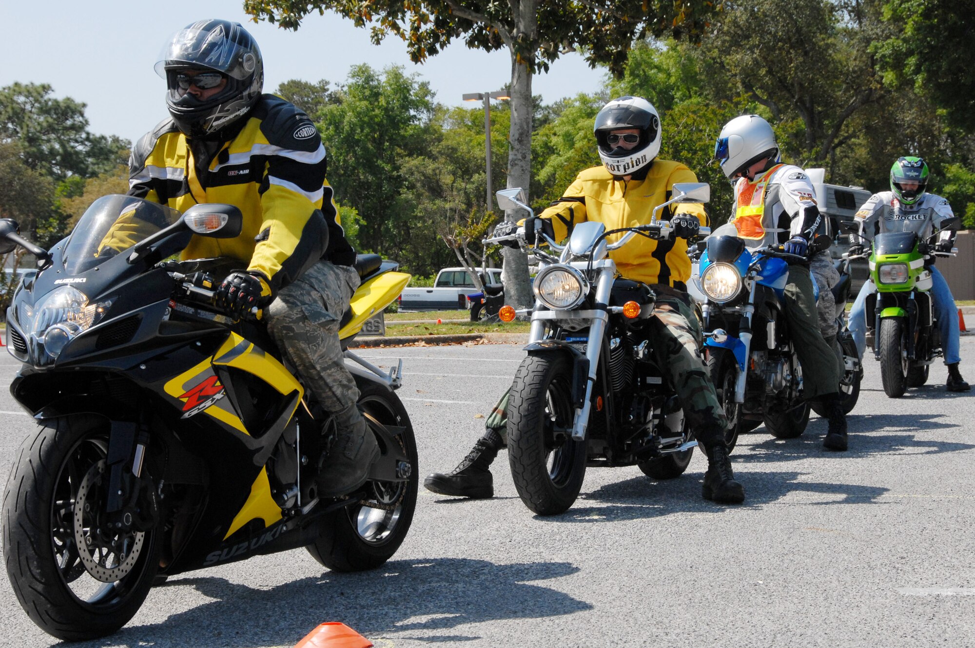 Staff Sgt. Marco Knight, 33rd Maintenance Squadron, and other riders wait their turn before entering the motorcycle riding skills course April 29 at Eglin Air Force Base, Fla.  Sergeant Knight won the “slow race” competition with a 45 second time.  The slow-race tests riders’ ability to balance the bike while moving forward.  Unlike a typical race, the last rider to cross the finish line wins.  The riding skills course was part of the 2nd Annual Team Eglin Motorcycle Safety Day event.  Approximately 150 riders came out to the safety discussions, riding competition and group ride.  Photo by Staff Sgt. Samuel King Jr.