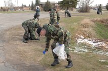 MINOT AIR FORCE BASE, N.D.— Members of the 5th Bomb Wing pick up garbage during the base wide clean-up April 25. Each squadron on base participated in the event. (U.S. Air Force photo by Senior Airman Cassandra Jones)