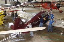 MINOT AIR FORCE BASE, N.D.— Airmen from Minot AFB volunteer their time and effort to help clean planes at the Dakota Territory Air Museum  April 24 and 25. The air museum  just finished major renovations to the facility, which caused a lot of dust and dirt to collect on the planes that Airmen cleaned. (U.S. Air Force photo by Senior Airman Cassandra Jones)