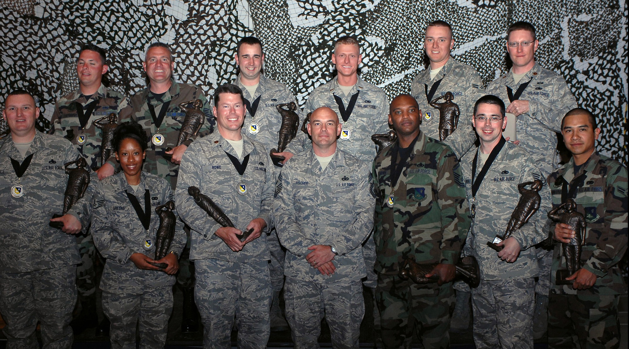 CANNON AIR FORCE BASE, N.M. -- Airmen from the 27th Special Operations Wing Maintenance Group display their awards following the Maintenance Professional of the Year awards banquet ceremony on April 26 at Hangar 126. Chief Master Sgt. Daniel Fischer, 27th Special Operations Wing command chief, (front, center) also attended the ceremony. (U.S. Air Force photo by Airman Basic Danielle Martin)