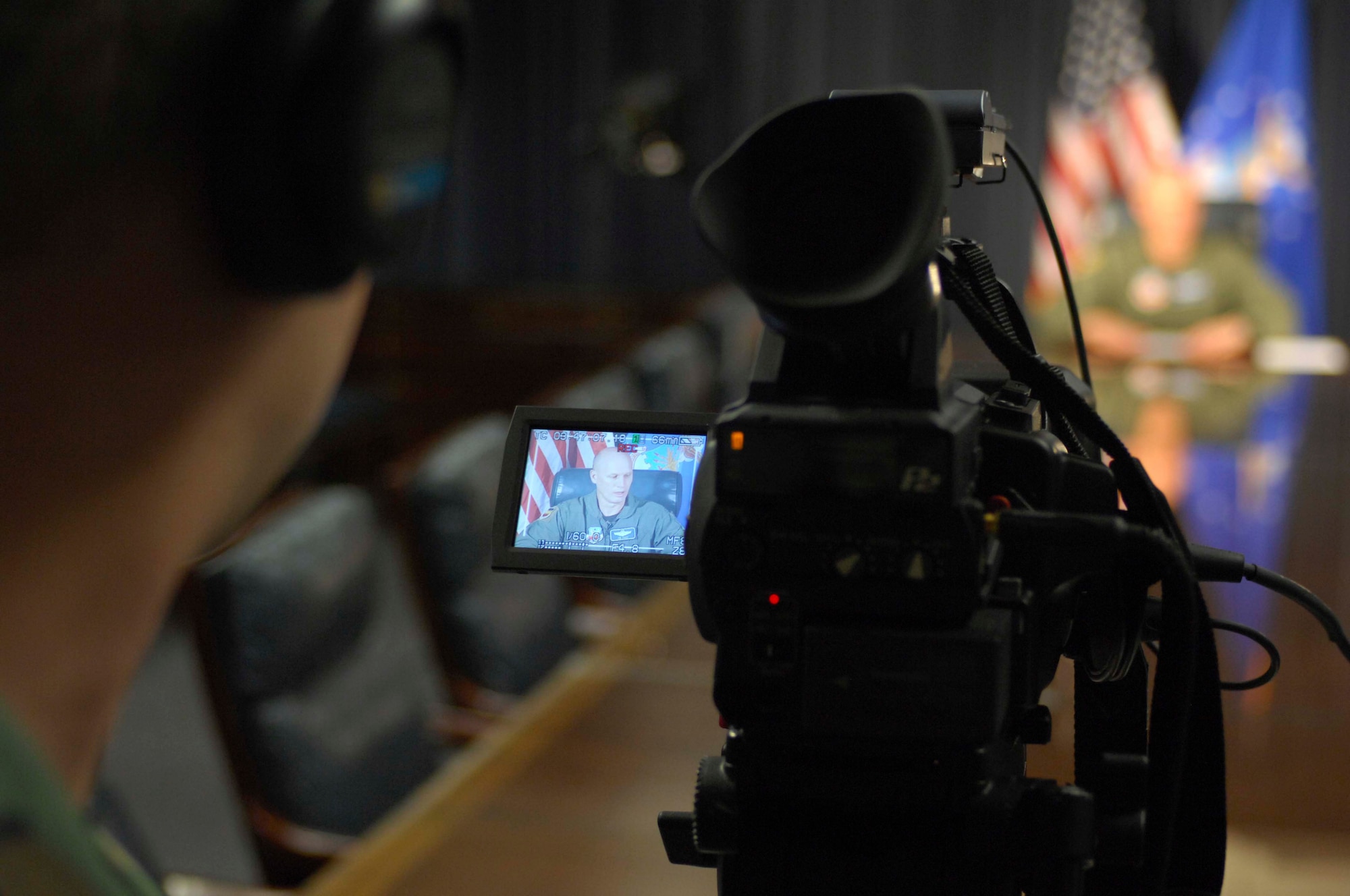 SHAW AIR FORCE BASE, S.C. -- Airman 1st Class Michael Cowley, 20th Fighter Wing Public Affairs videographer, records Col. James Post, 20th Fighter Wing commander,  delivering a safety message for a Commanders Access Channel commercial April 24. Commercials showcasing safety for the 101 critical days of summer and Shaw's Sept. 6 air show will air on the CAC beginning in early May. (U.S. Air Force Photo/Staff Sgt. Henry Hoegen)