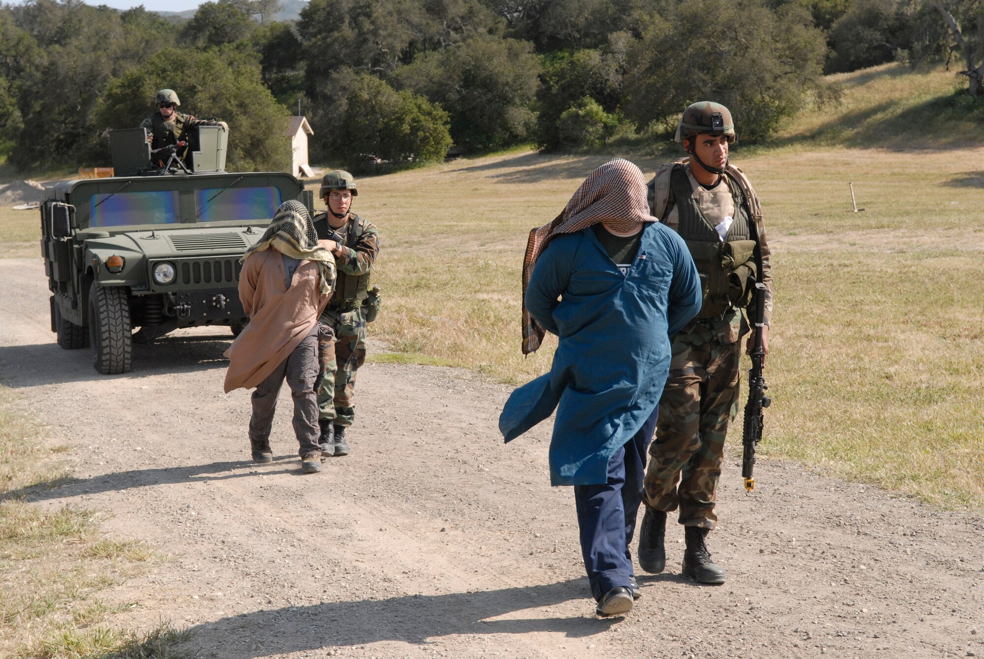 VANDENBERG AIR FORCE BASE, Calif. --  Airmen of the 30th Security Forces Squadron escort detainees back to base during the North Star exercise April 23 here.  (U.S. Air Force photo / Senior Airman Christopher Hubenthal)