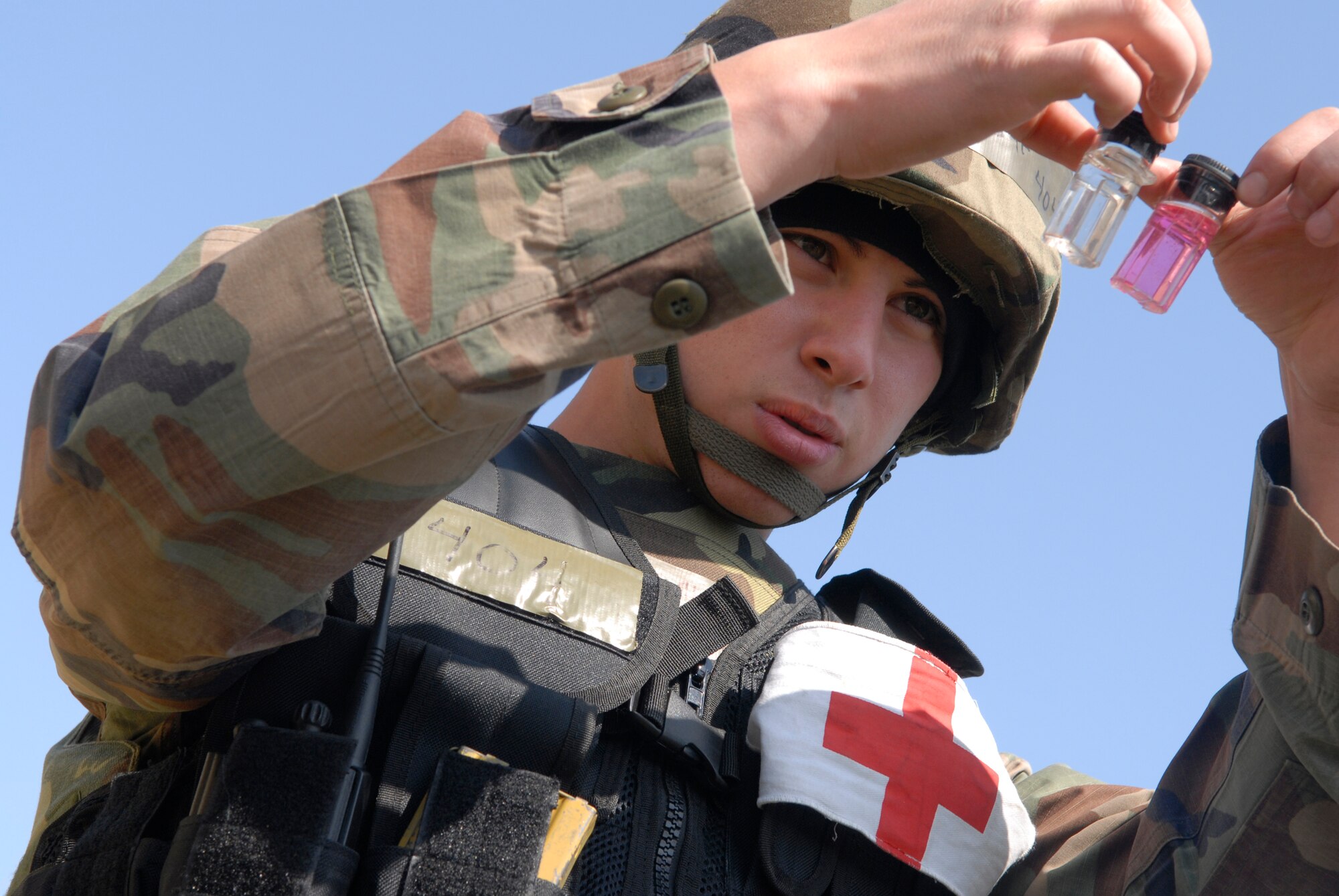 VANDENBERG AIR FORCE BASE, Calif. --  Airman 1st Class Brian Cardenas of the 30th Medical Group checks the chlorine level in the "water buffalos" for contamination during the exercise here. Checking chlorine levels in the water tanks ensures the military is meeting environmental standards. (U.S. Air Force photo / Senior Airman Christopher Hubenthal)