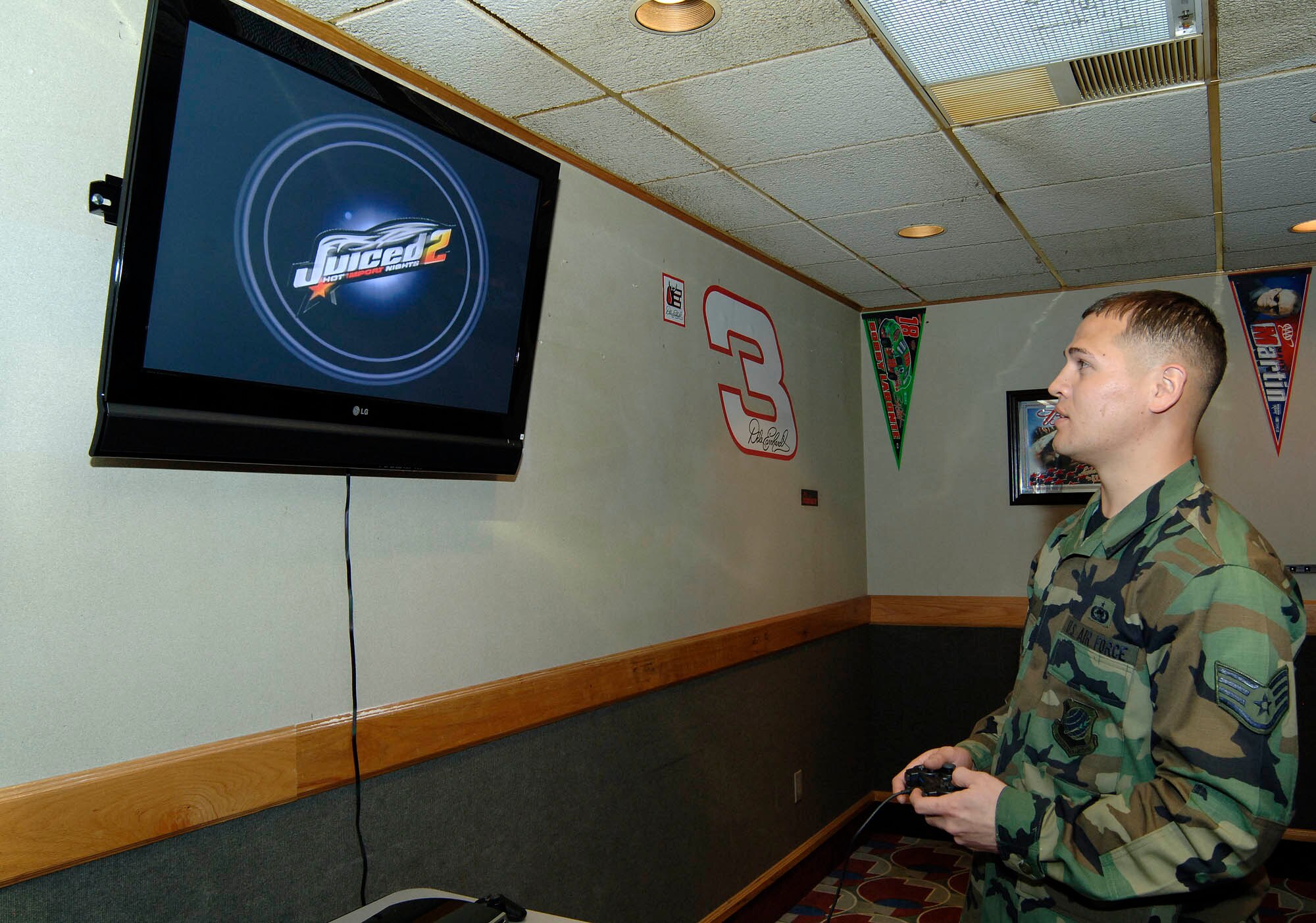 FAIRCHILD AIR FORCE BASE, Wash. – Staff Sgt. Michael Reilly, 92nd Logistics Readiness Squadron, plays a video game on the Playstation 3 gaming console at SkyBox April 25. The gaming console is a new addition to the newly remodeled enlisted club. (U.S. Air Force photo / Staff Sgt. JT May III)