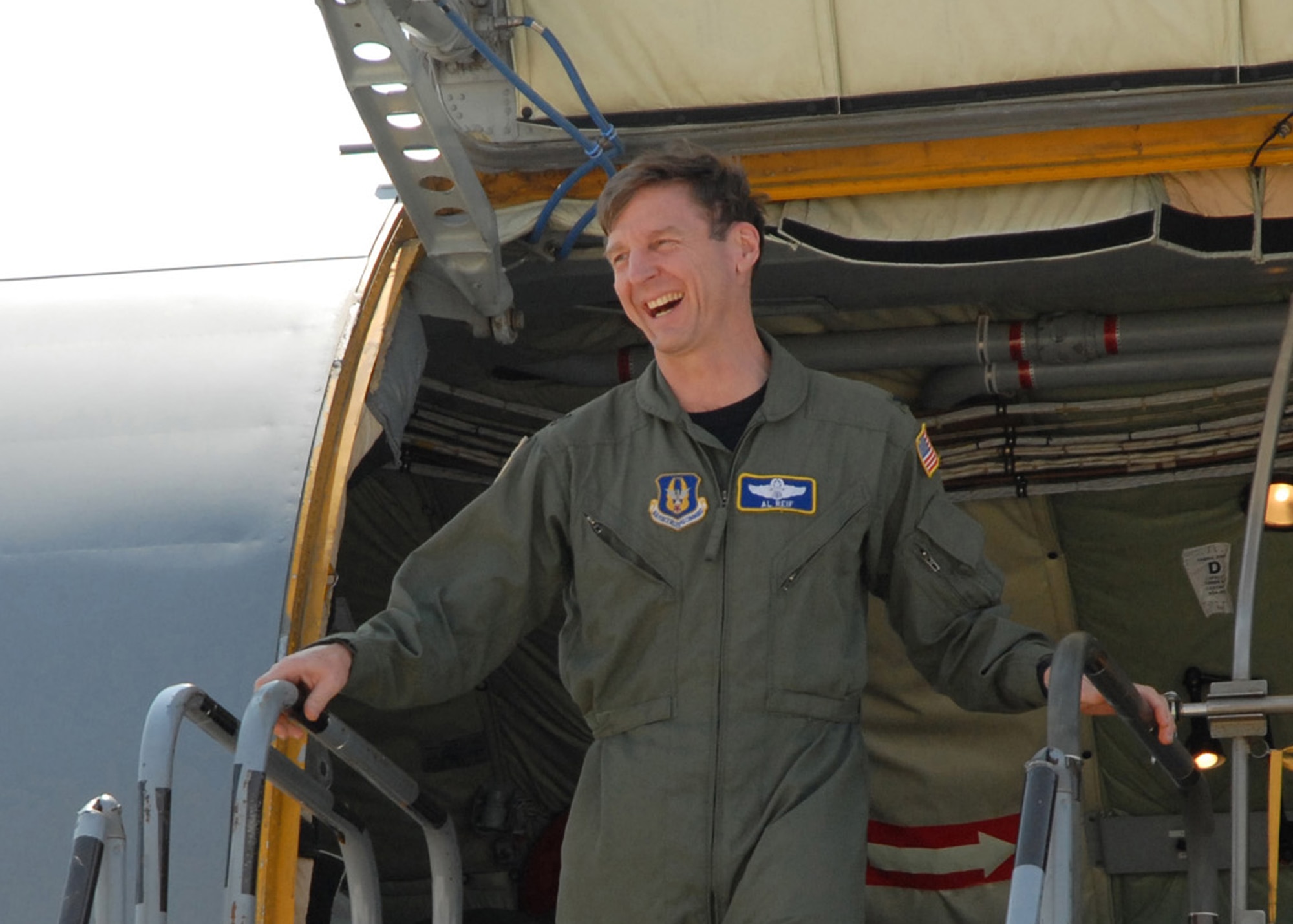 BEALE AIR FORCE BASE, CALIF. -- Air Force Reservist Col. Al Reif, 940th Air Refueling Wing commander, laughs at the sight of his family and staff waiting on the flight line here Apr. 25, 2008, to give him the traditional water dousing after his final or "fini" flight in one of the wing's KC-135R Stratotankers. The jet Col. Reif flew is one of the last two scheduled to depart May 3, 2008, for reassignment to the 916th ARW, Seymour Johnson AFB, N.C. While the 940th ARW is drawing down its legacy KC-135R mission, as directed by the Base Closure and Realignment Commission, Beale Reservists are partnering with active duty Airmen to support emerging command and control, and intelligence, surveillance and reconnaissance missions. (U.S. Air Force photo/Master Sgt. Ellen L. Hatfield)