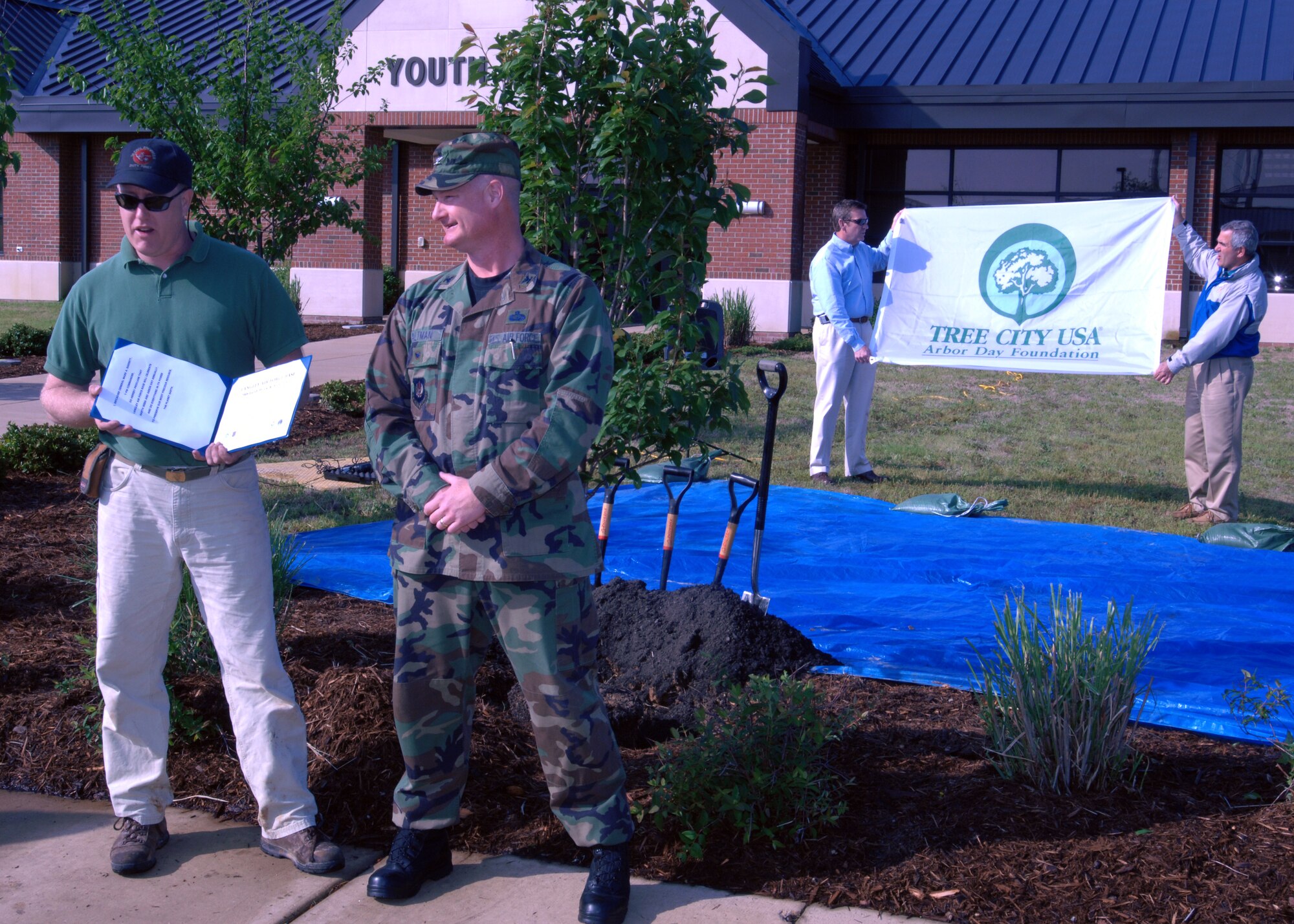 LANGLEY AIR FORCE BASE, Va. --  Col. Kevin Altman, 1st Mission Support Group commander, gives a proclamation for a tree planting ceremony on behalf of the 1st Fighter Wing commander, Brig. Gen. Mark Barret, here April 29.  The ceremony was to celebrate both Arbor Day and Earth Day and to show the Air Force's support of the environment.  (U.S. Air Force photo/Senior Airman Christopher L. Ingersoll)