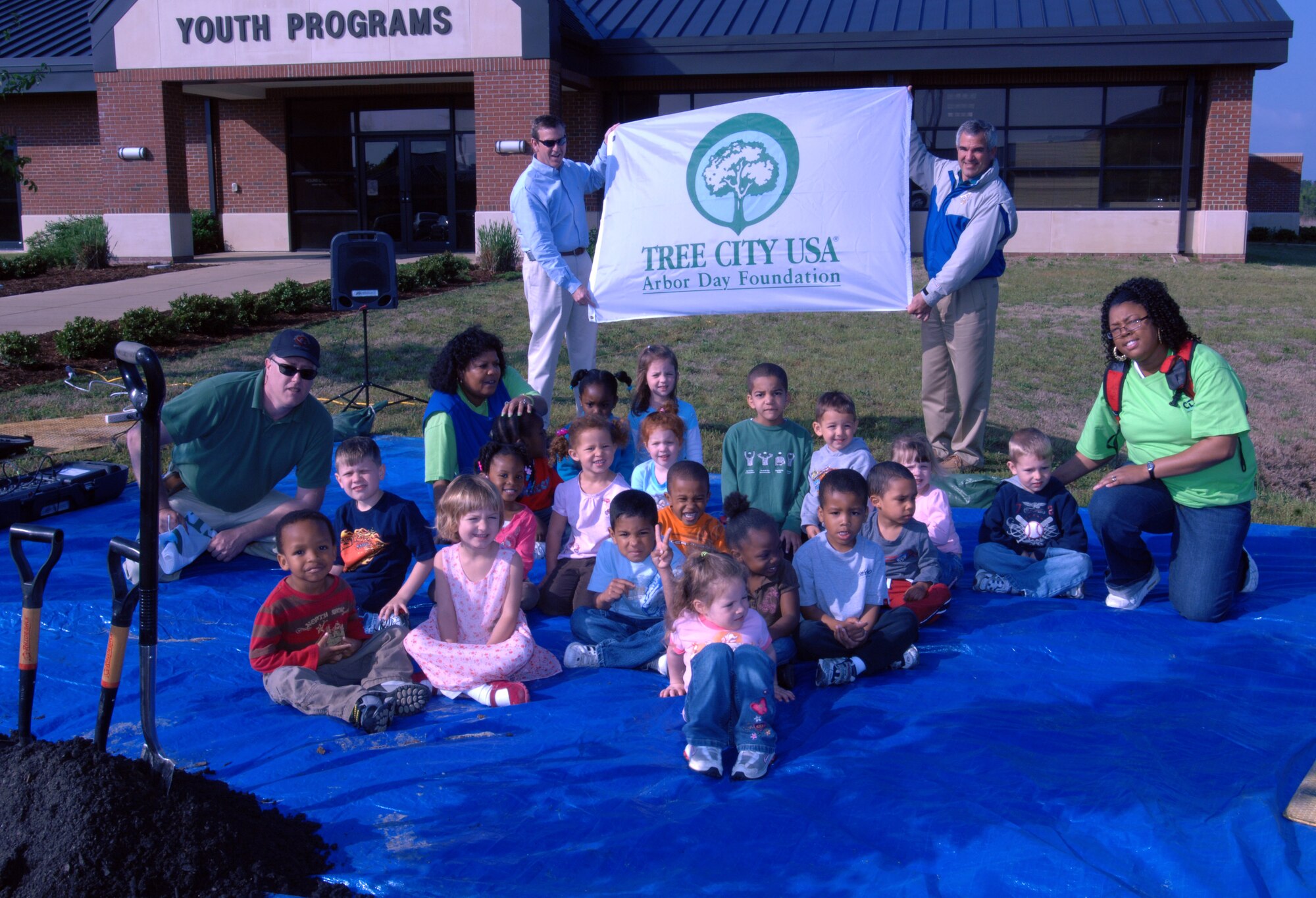 LANGLEY AIR FORCE BASE, Va. --  Children from the Russ Child Development Center await for the start of a tree planting ceremony here April 29.  The ceremony was to celebrate both Arbor Day and Earth Day and to show the Air Force's support of the environment.  (U.S. Air Force photo/Senior Airman Christopher L. Ingersoll)
