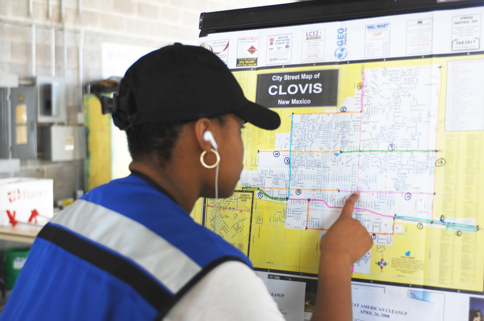 CANNON AIR FORCE BASE, N.M. -- Airman Shelly-Ann Douglas, 27th Special Operations Security Forces Squadron, looks  at a map outlining areas to clean during the Great Americnan Cleanup on April 26. More than 200 Airmen joined with residents from Clovis, N.M., to fill nearly 1,200 bags with 94,000 pounds of trash. (U.S. Air Force photo by Greg Allen)