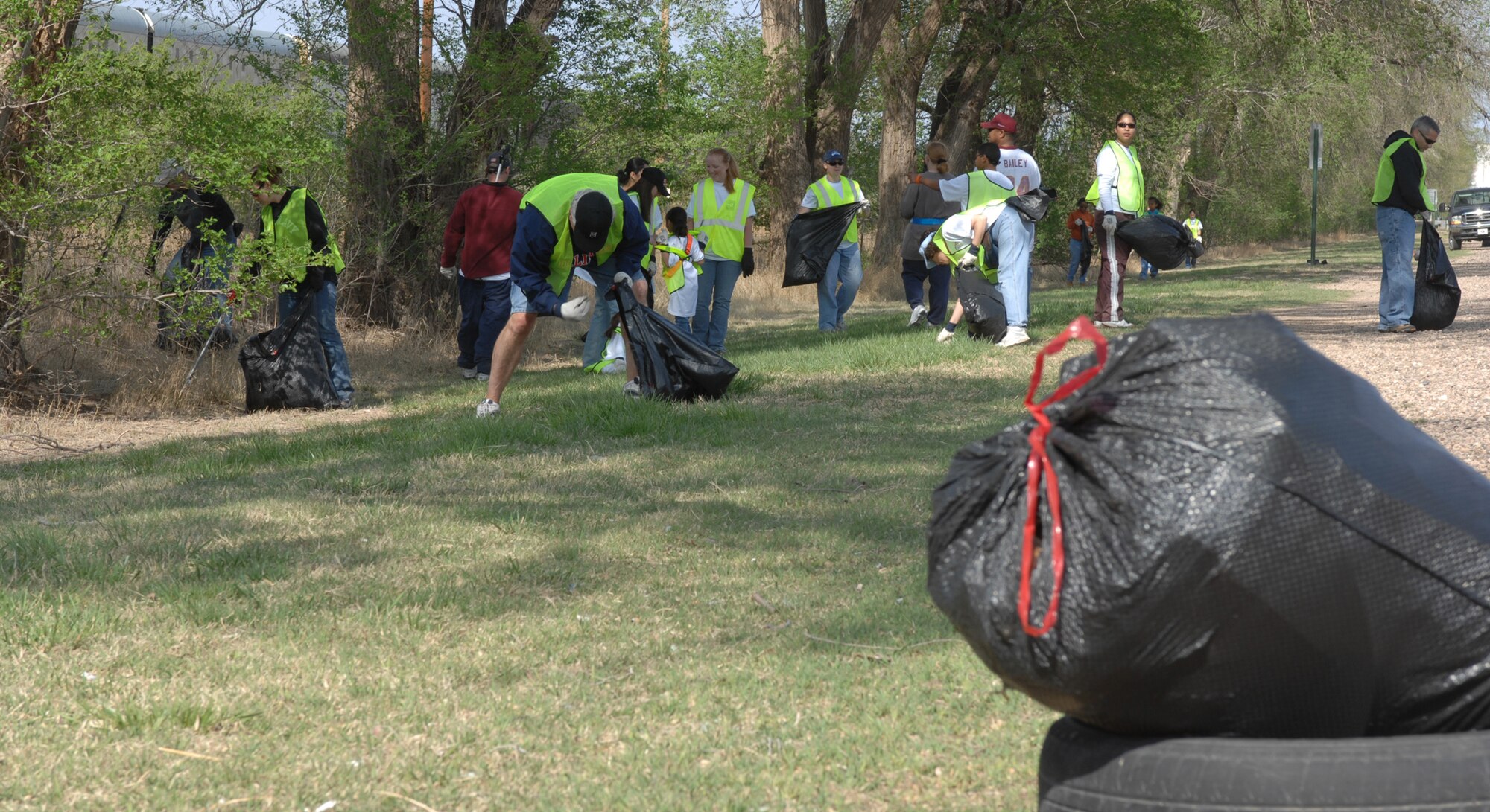 CANNON AIR FORCE BASE, N.M. -- Some of the more than 250 Airmen pick up trash in Clovis, N.M., as part of the Great American Cleanup on April 26. Nearly 1,200 bags were filled with 94,000 pounds of garbage in about four hours. (U.S. Air Force photo by Greg Allen)