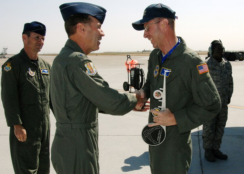 Brig Gen Mark S. Solo, Deputy Director, Air, Space and Information Operations, Headquarters Air Mobility Command is greeted by Col. Steven J. Arquiette, 60 Air Mobility Wing Commander upon his arrival to Travis AFB, CA.  Brig Gen Solo was the delivery official for C-17 tail number 77172, which is the twelfth of  thirteen C-17s scheduled to be delivered to Travis AFB. Also shown (left) is Lt Colonel Charles D. Planer, representing the 349 Air Mobility Wing Commander, and (right) SSgt Bernard M. Thomas, 860 AMXS.U.S. Air Force Photo by David W. Cushman, DAFC