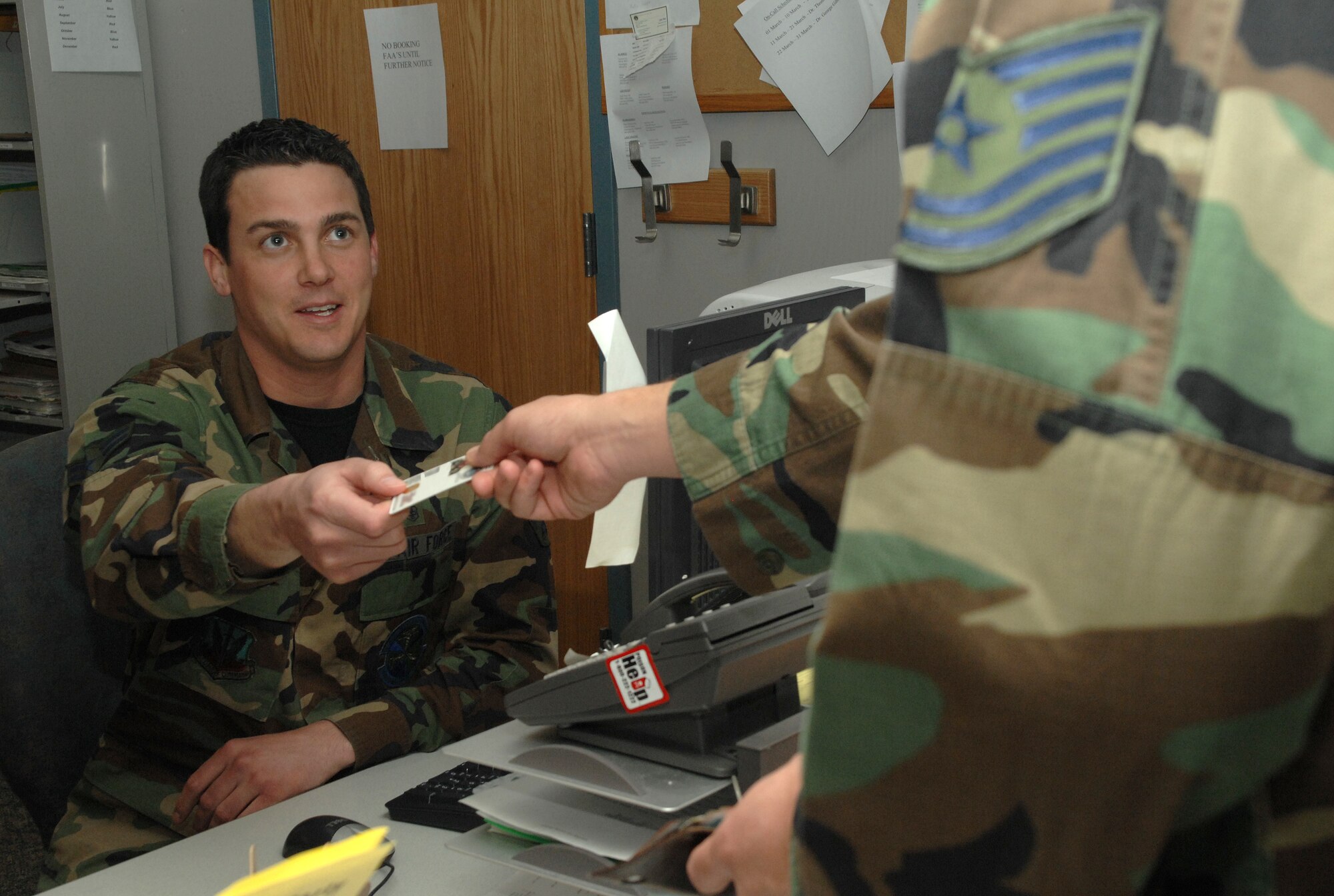 Airman 1st Class Jeremy West, 49th Medical Group, checks a patient in to the Flight Medicine Clinic here. He is among the many technicians being recognized during National Nurse's Week here. (USAF photo by A1C Tiffany Trojca)