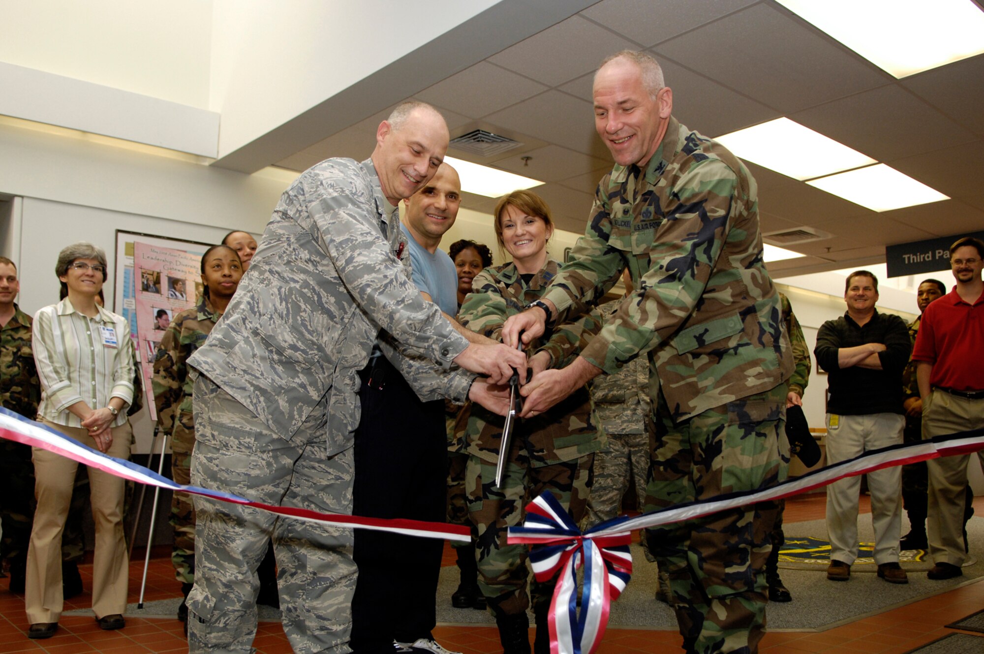 HANSCOM AFB, Mass. – (From left to right) Col. Randy Dobbins, 66th Medical Group commander, Joe Costa, owner of The Daily Bagel Café, Capt. Edyta Hilyard, Medical Logistics Flight commander and Col. Tom Schluckebier, 66th Air Base Wing commander, officially cut the ribbon on April 22 to open The Daily Bagel Café located in the 66 MDG building. The café offers a full menu of breakfast and lunch items. The café will be open Mon. to Fri. from 7 a.m. to 3 p.m. (U.S. Air Force photo by Mark Wyatt)

