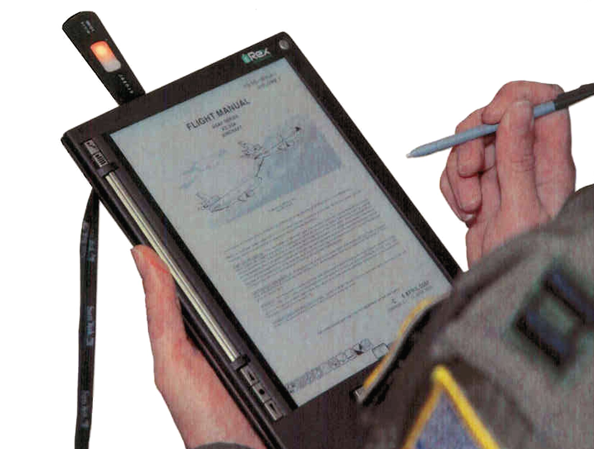 The iRex Iliad e-Reader, a "commercial-off-the-shelf" portable publications reader able to store data and read data from USB-compatible flash drives was the device used by the U.S. Air Force Expeditionary Center's Air Mobility Battlelab for their demonstration of the Paperless Aircrew Publications e-Reader initiative.  Through the AMB's work, the reader or one like it is being recommended to help aircrews carry less paper for their flying missions.  (Air Force Photo Illustration/Art Tollefson) 