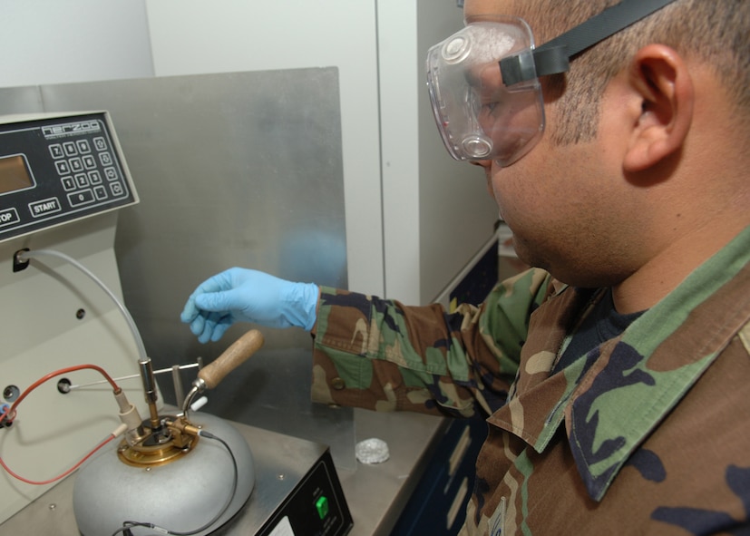 DYESS AIR FORCE BASE, Texas -- Senior Airman Rogelio Guerrero monitors a flash test on JP-8 jet fuel April 24. A flash test determines the amount of heat the fuel can collect before becoming potentially unstable. (U.S. Air Force Photo by Airman 1st Class Micheal Breaux)
