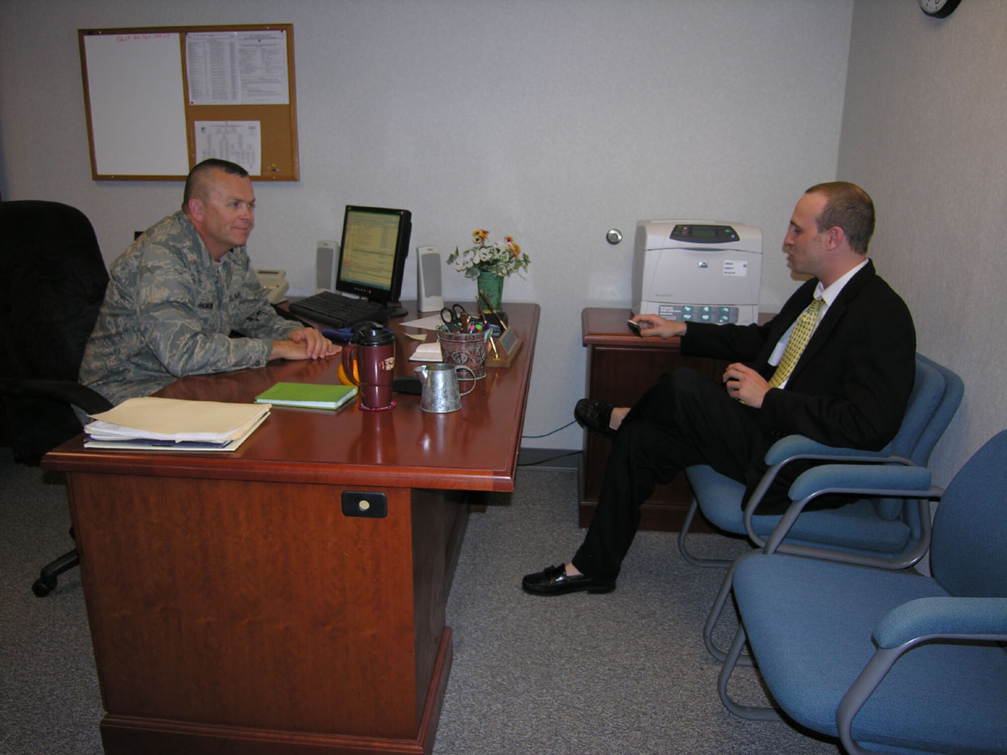 SEYMOUR JOHNSON AIR FORCE BASE, N.C. -- Lt. Col. Tim Horton talks with Goldsboro News Argus reporter, Ken Fine, about his recent deployment to Iraq. U.S. Air Force photo/Ms. Donna Lea