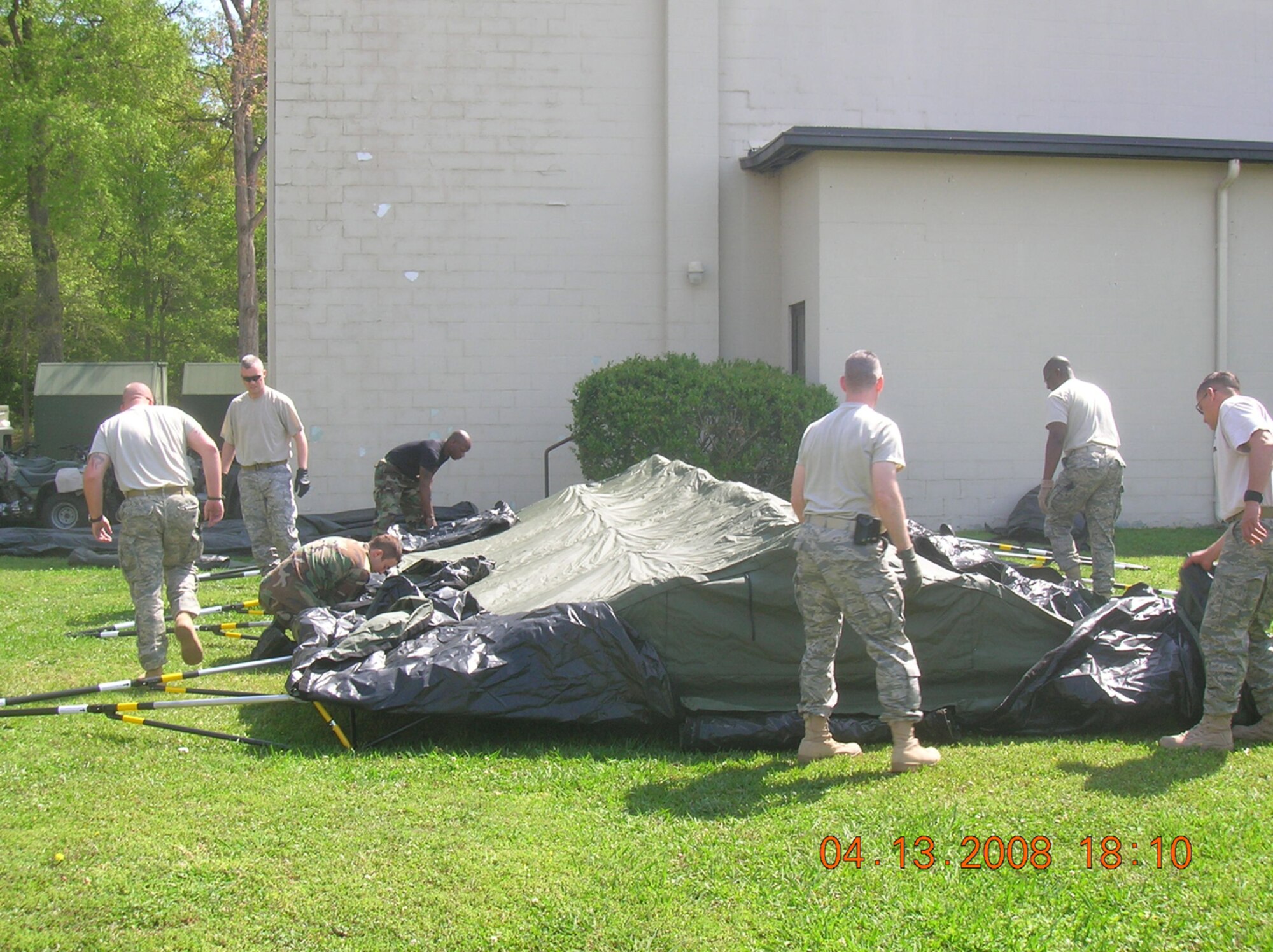 SEYMOUR JOHNSON AIR FORCE BASE, N.C. -- Reservists with the 916th Security Forces Squadron practice erecting a tent during the April unit training assembly. More 916th security forces members are preparing for overseas deployments while several others are reporting to bases stateside to support active duty installations. U.S. Air Force photo/SrA Veronica Odom