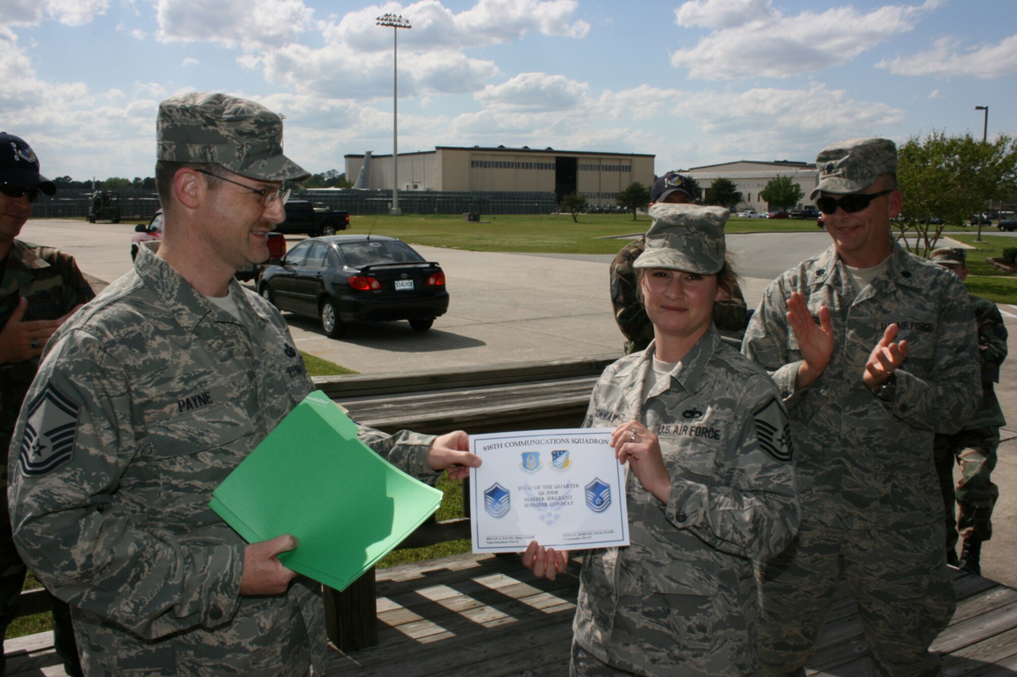SEYMOUR JOHNSON AIR FORCE BASE, N.C. -- Master Sgt. Jennifer Conway (right) is presented with a recognition certificate for her selection as the 916th Communication Squadron's  Senior Non-commissioned Officer of the Quarter. Sergeant Conway is a ground radio communication technician.