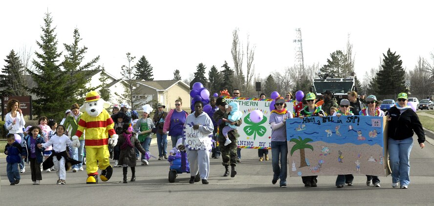 MINOT AIR FORCE BASE, N.D. -- Children paraded to a block party held at the Youth Center April 25 in celebration of the Month of the Military Child. Military members, spouses and children and marched from J.R. Rockers to the Youth Center. (U.S. Air Force photo by Airman 1st Class Jesse Lopez)