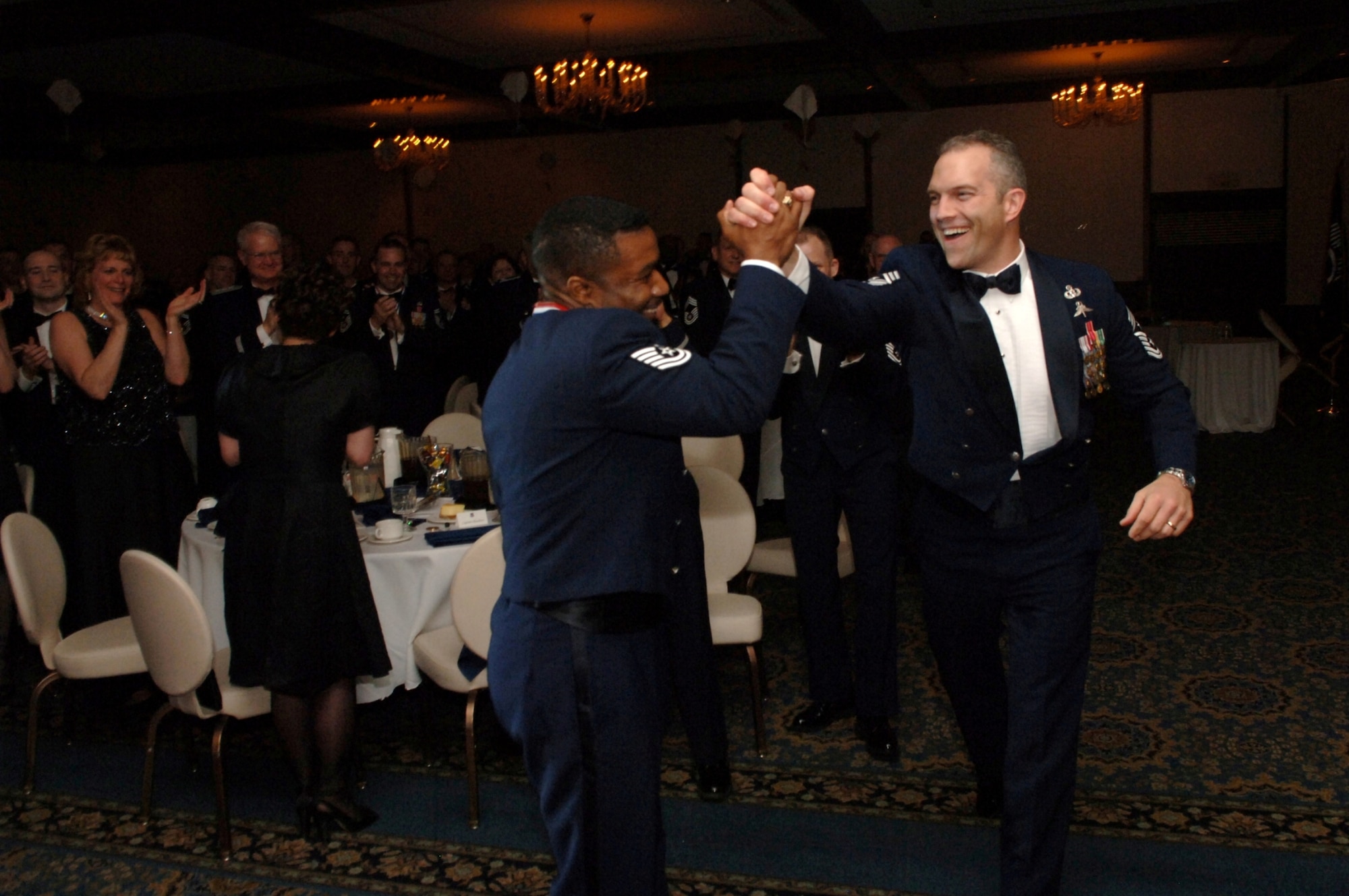 Tech Sgt. Larnell Smith, 3rd Air Force A4 Directorate, Ramstein Air Base, Germany is congratulated by  Chief Master Sgt. Martin S. Klukas, the 3rd Air Force Command Chief Master Sergeant, upon being named as the 2007 U.S. Air Forces in Europe Noncommissioned Officer of the Year.  (U.S. Air Force Photo by Airman 1st Class Tony Ritter)