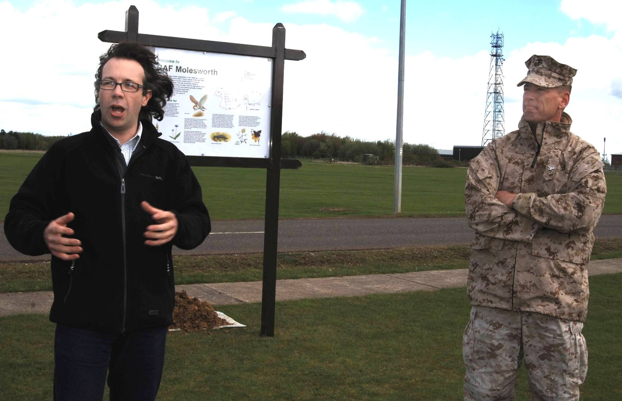 423rd Civil Engineering Squadron Environmentalist Mr. Jonathan A. Guy  Describes the unique flora and fauna including the rare great crested newt as JAC Commander, Marine Corps Col. Peter H. Devlin looks on during a ceremony on Earth Day 2008 at RAF Molesworth.  (U.S. Air Force photo by Staff Sgt Jocelyn L. Rich)