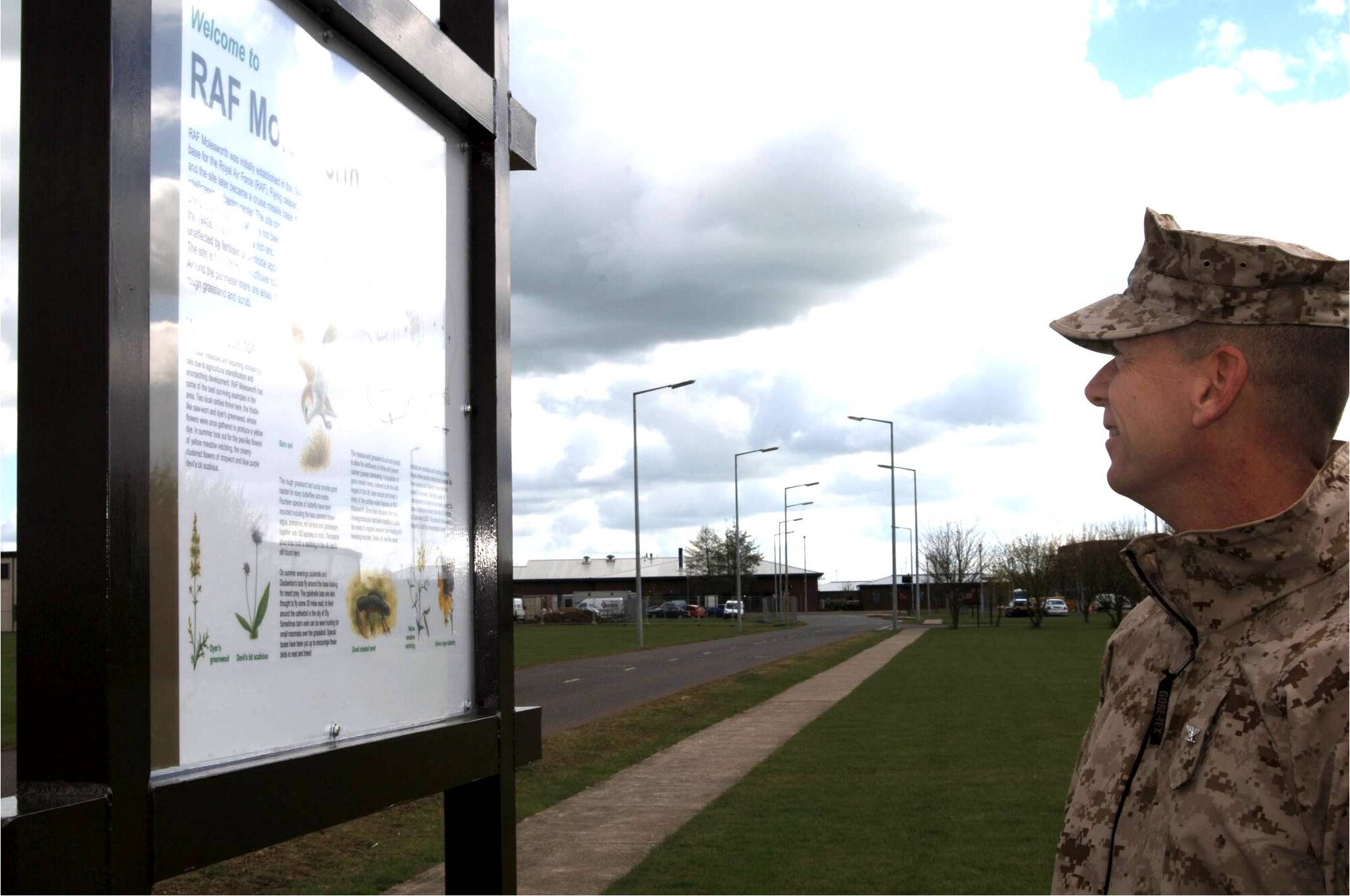 Marine Corps Col. Peter H. Devlin, JAC Commander reads an informational sign describing the habitat of the Great Crested Newt and other wildlife unique to RAF Molesworth during the 2008 Earth Day celebration on April 28th.  (U.S. Air Force photo by Staff Sgt. Jocelyn L. Rich)