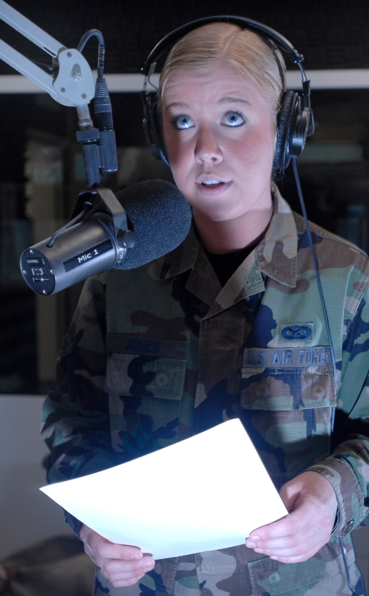 AVIANO AIR BASE, Italy --Radio DJ Airman 1st Class Caitlin Jones reads local Aviano information to the public April 25 at AFN detachment 8 in Area E.  Jones keeps Aviano Air Base up to date on upcoming events on "The Crave".  (U.S. Air Force photo/Airman 1st Class Ashley Wood)  